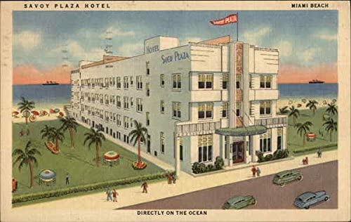 a hotel with palm trees and cars