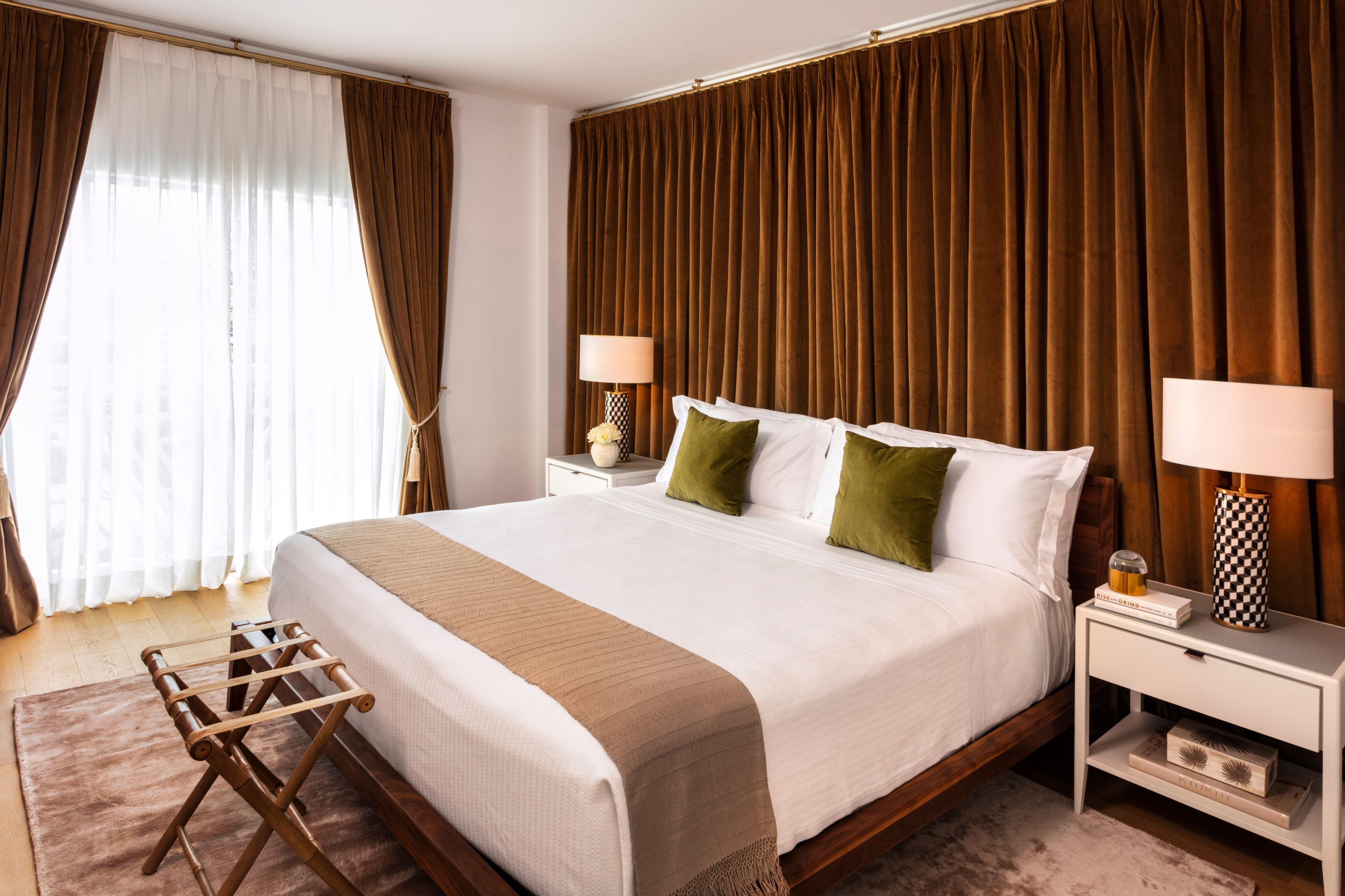 a bed with brown curtains