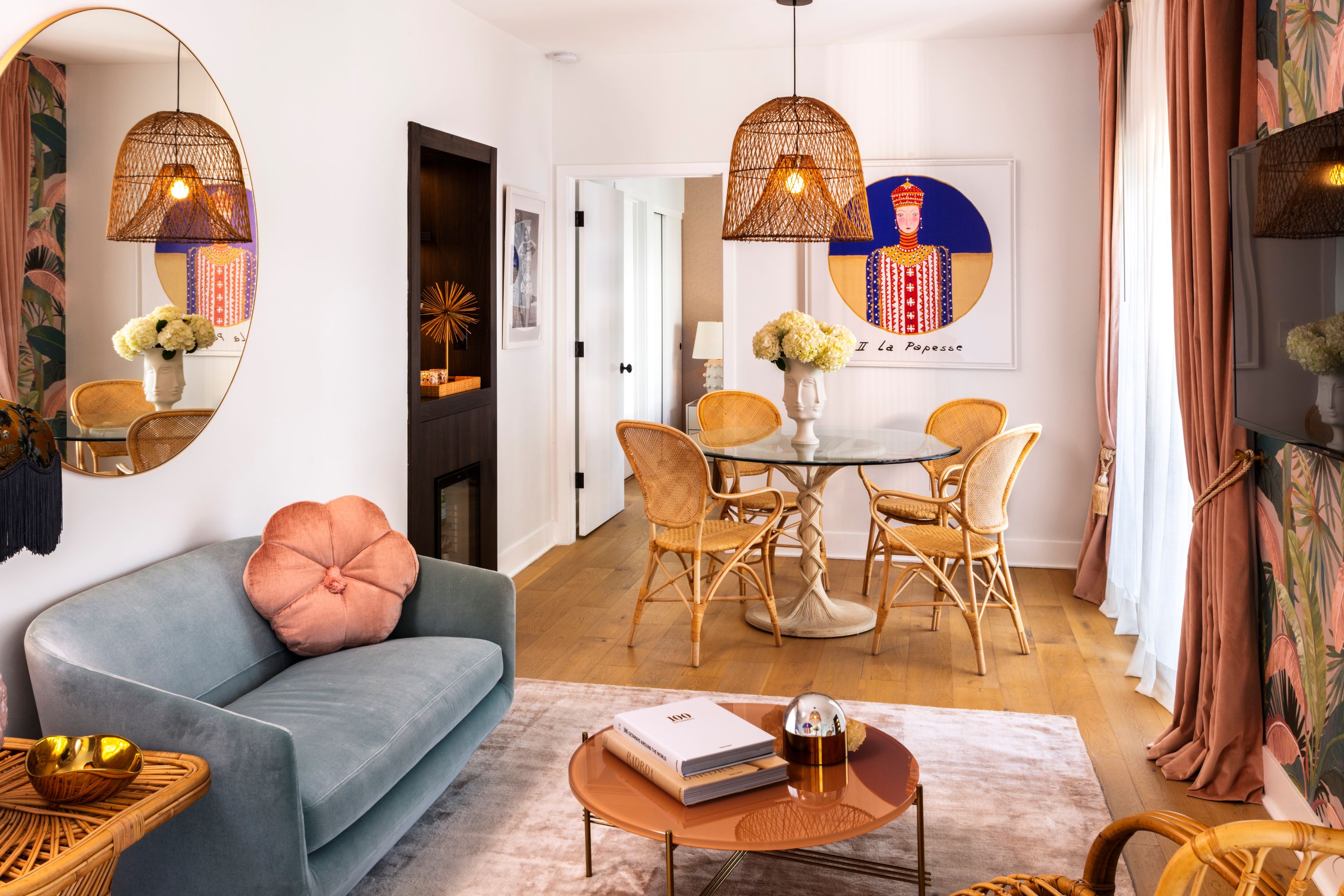 a living room with a table and chairs