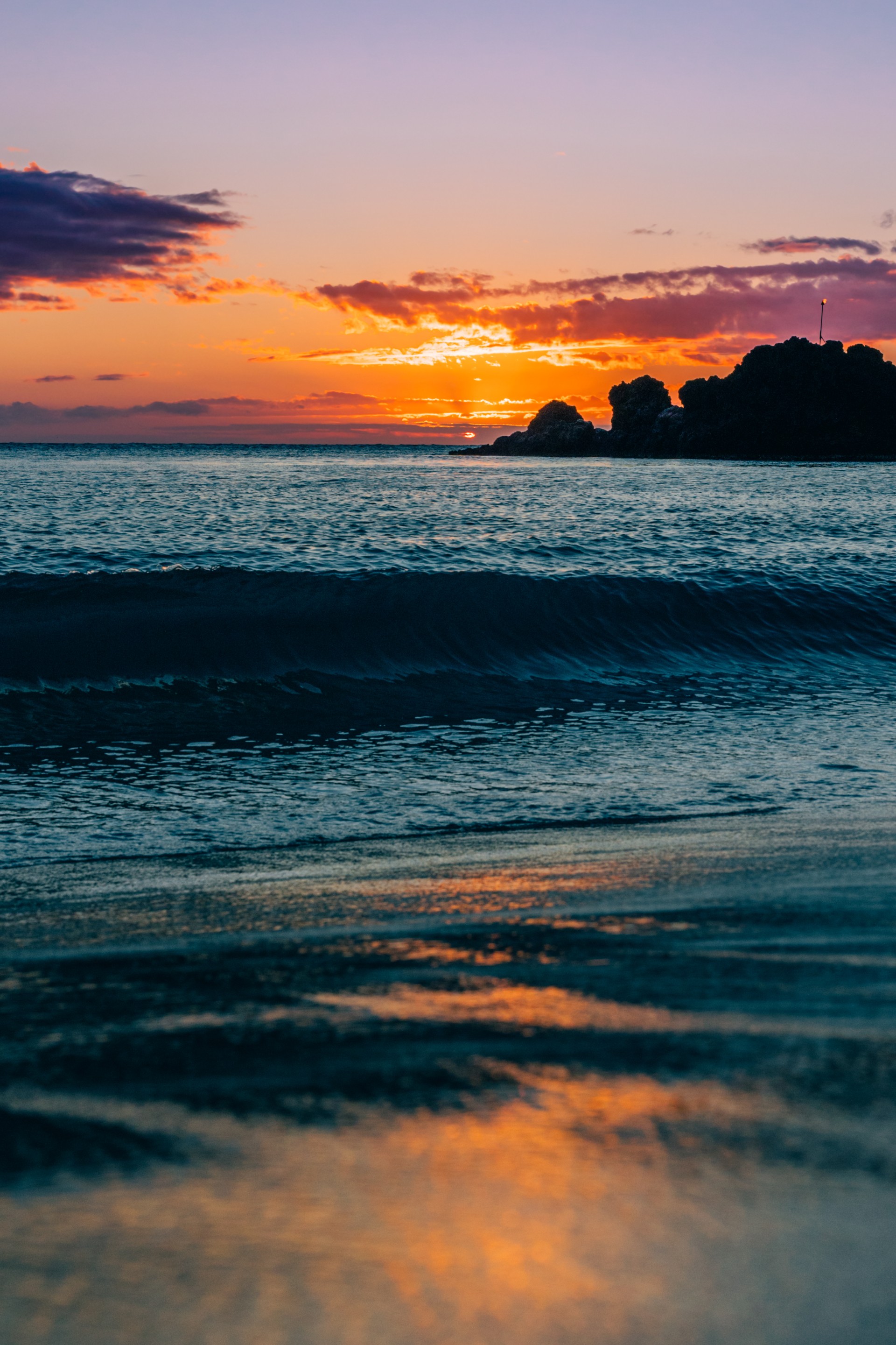 a sunset over a body of water