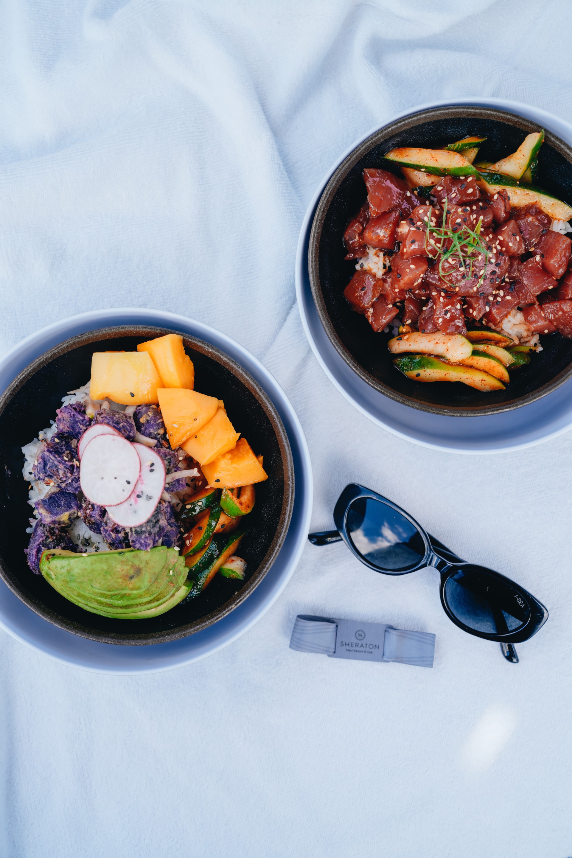 two bowls of food with sunglasses and a pair of sunglasses