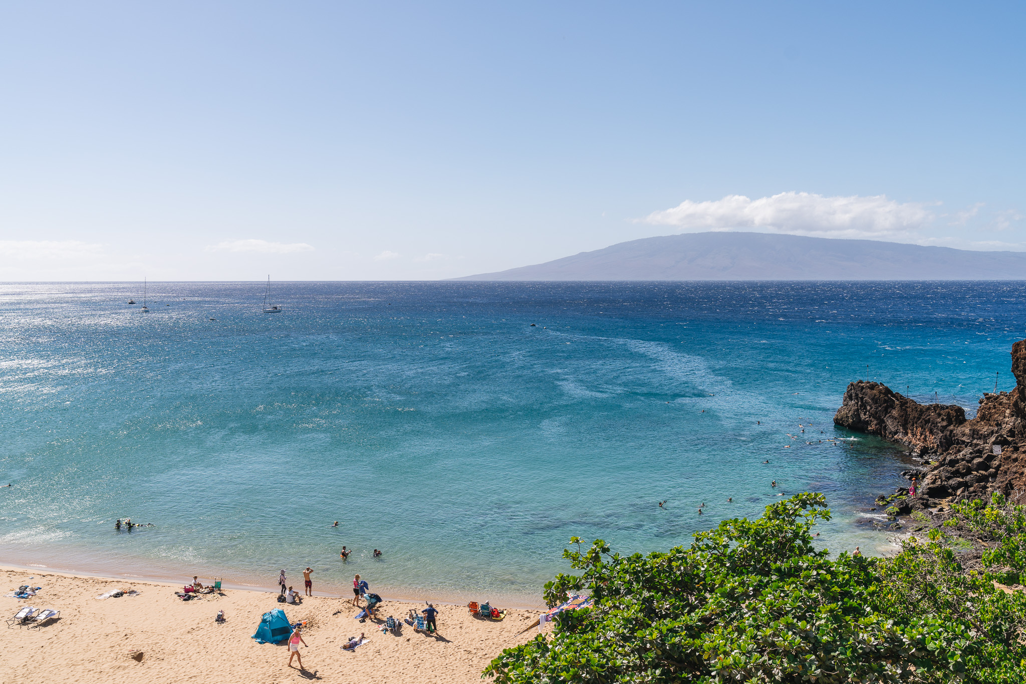 a beach with people on it