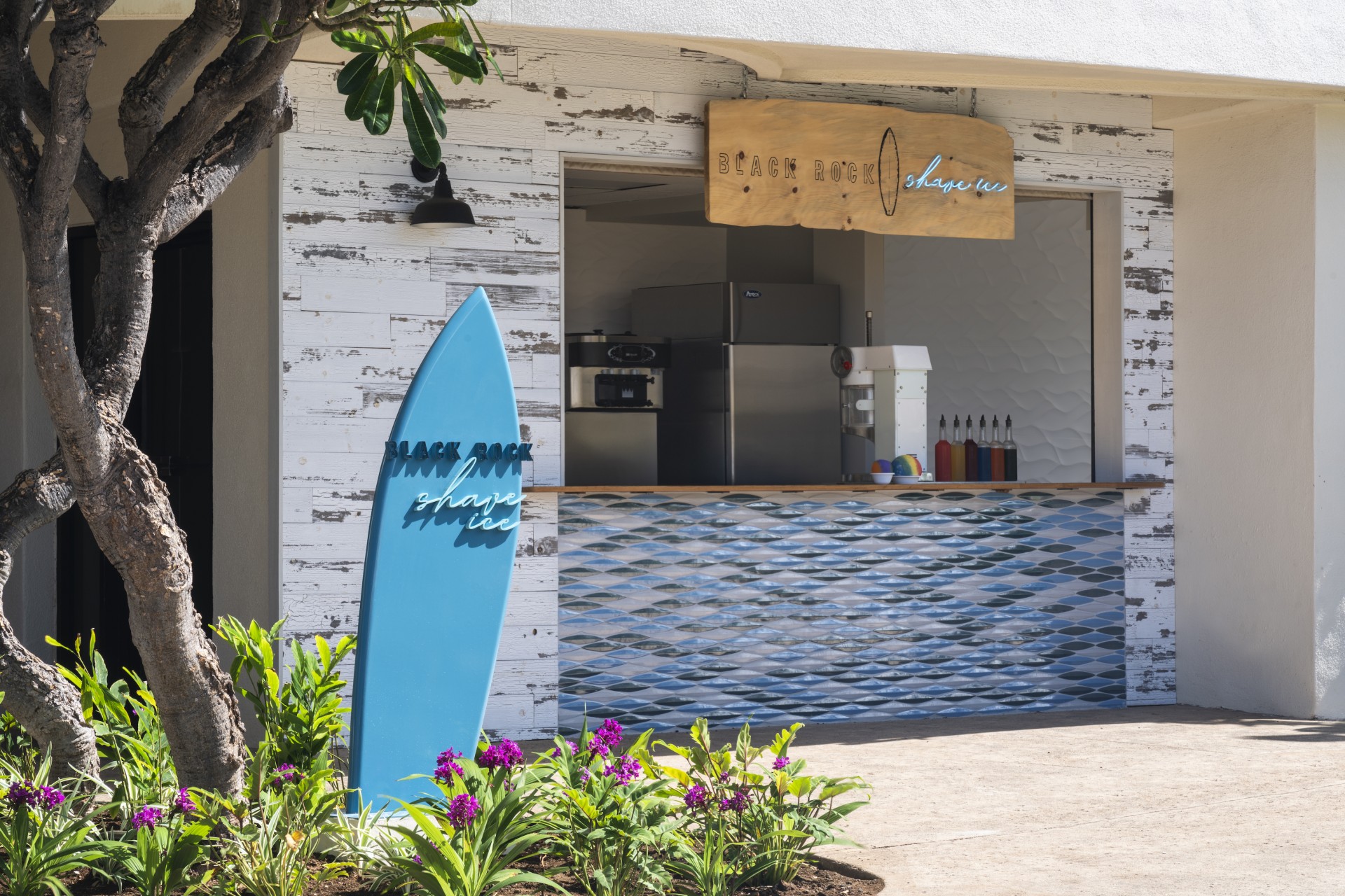 a blue surfboard in front of a store