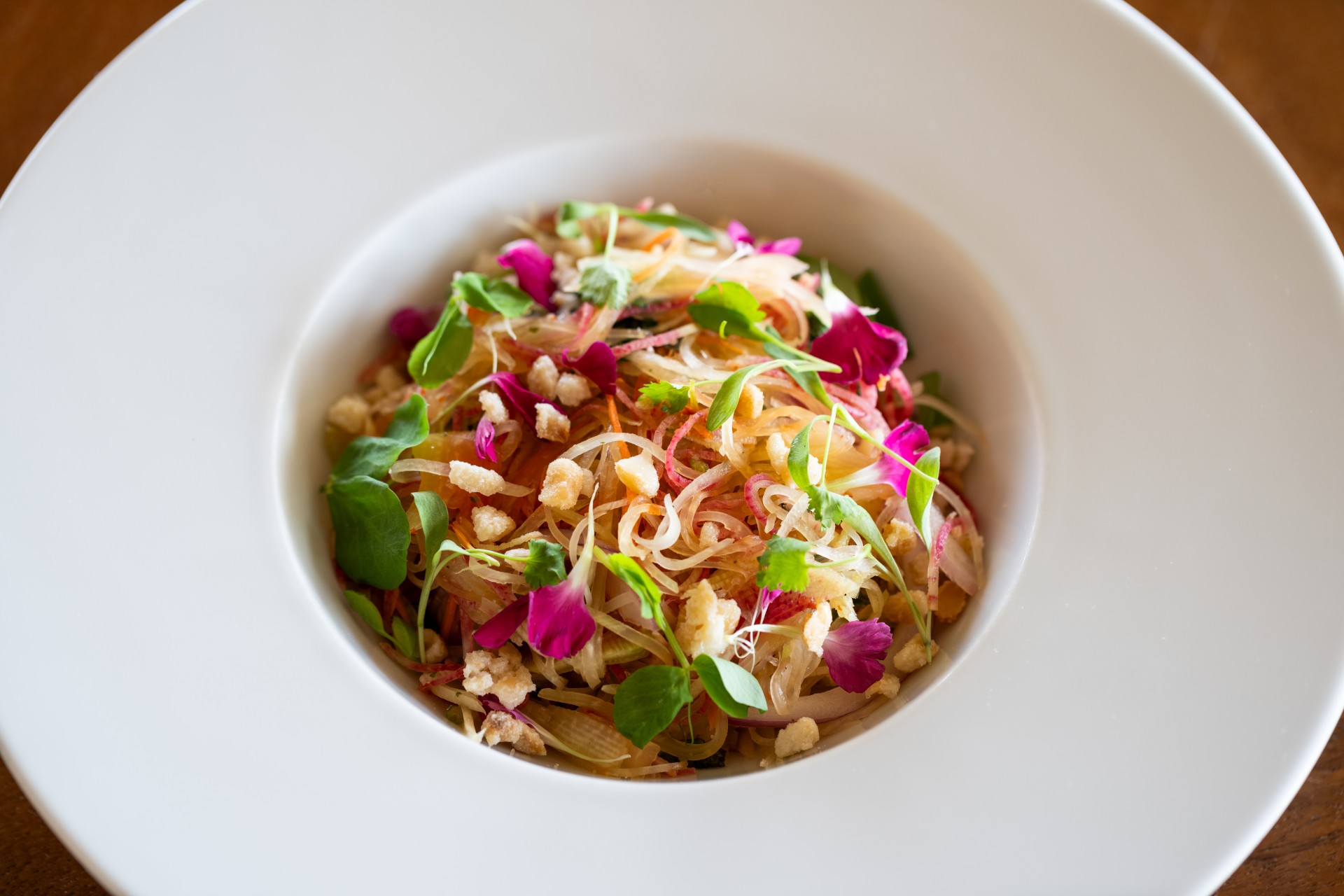 a bowl of food with flowers