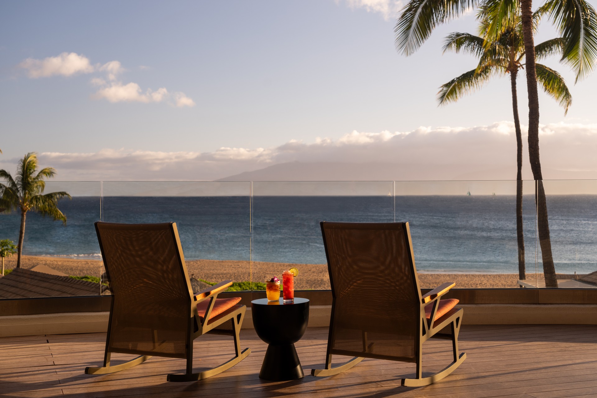 chairs on a deck overlooking a beach