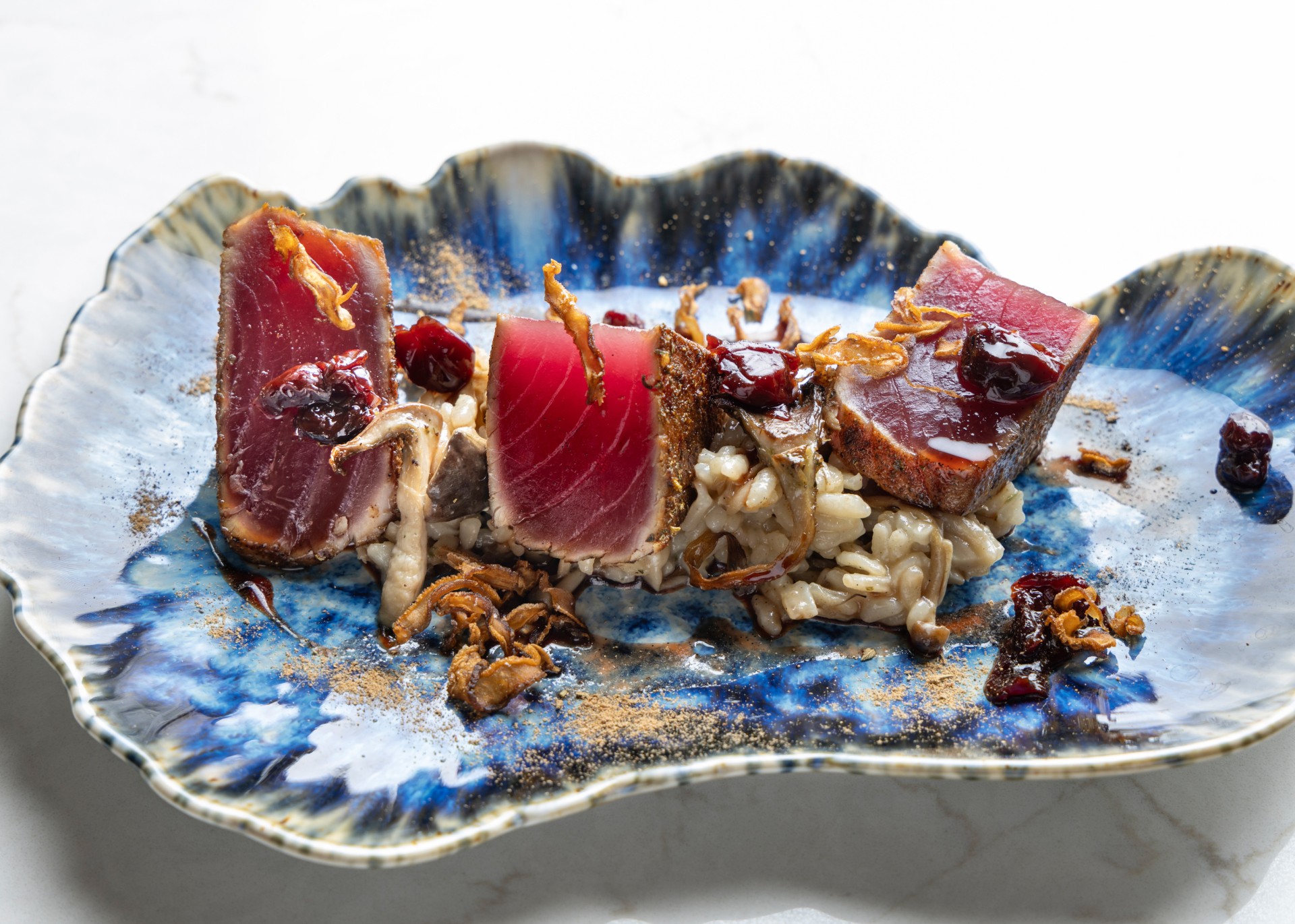 a plate of food on a marble surface