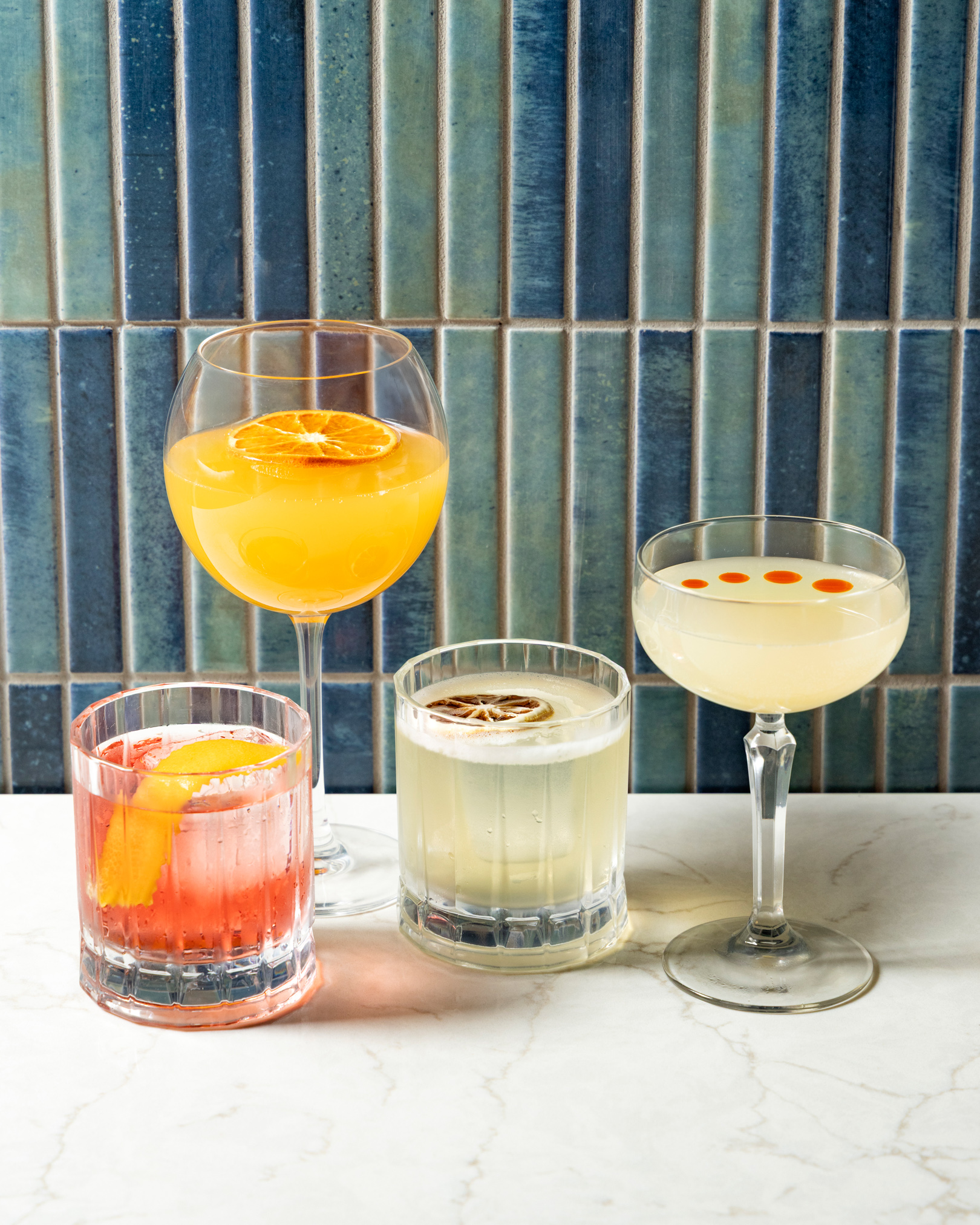 a group of different colored drinks