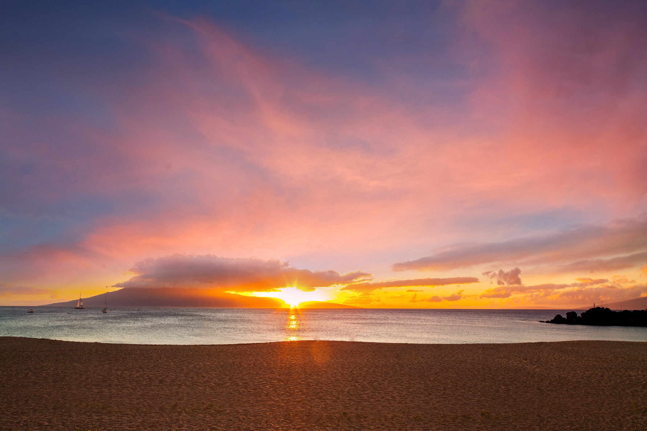 a sunset over a beach