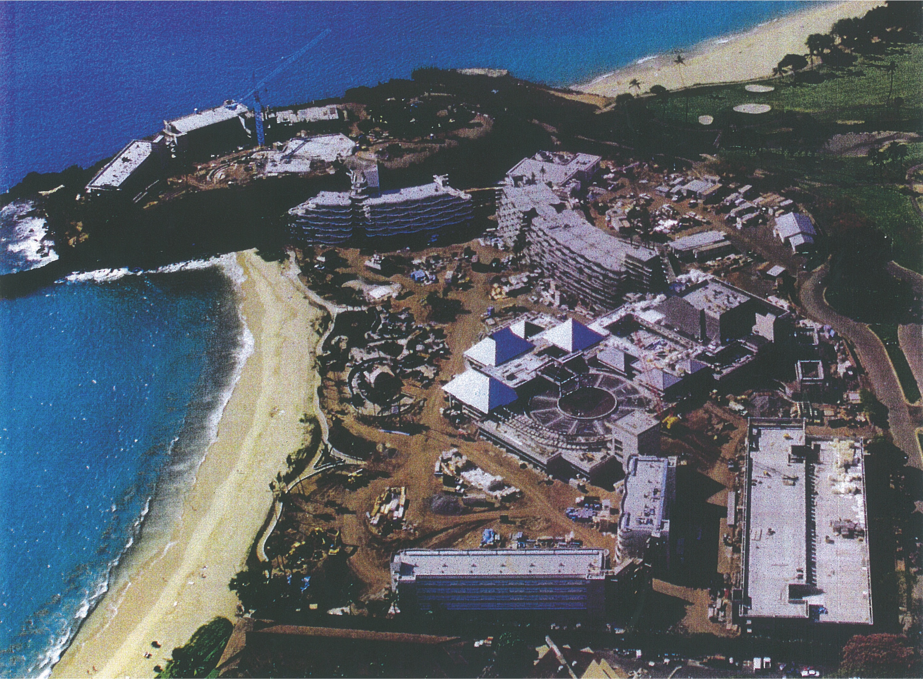 an aerial view of a beach and buildings