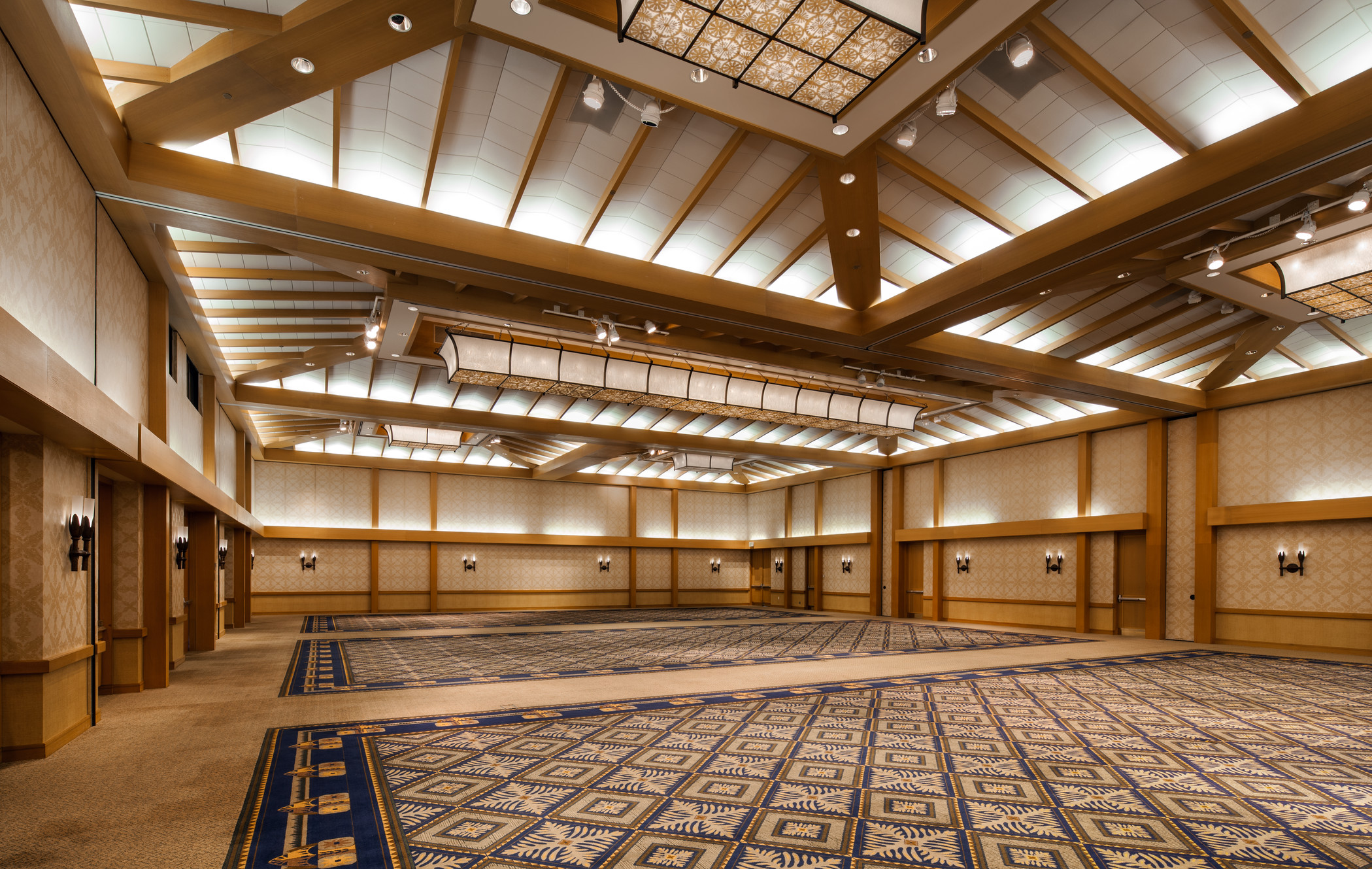 a large room with a carpet and lights