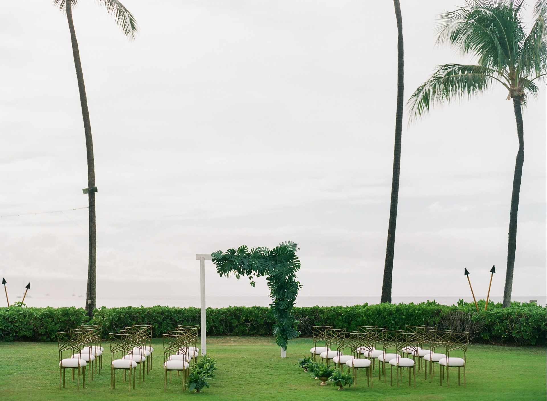 a group of chairs in a grass field
