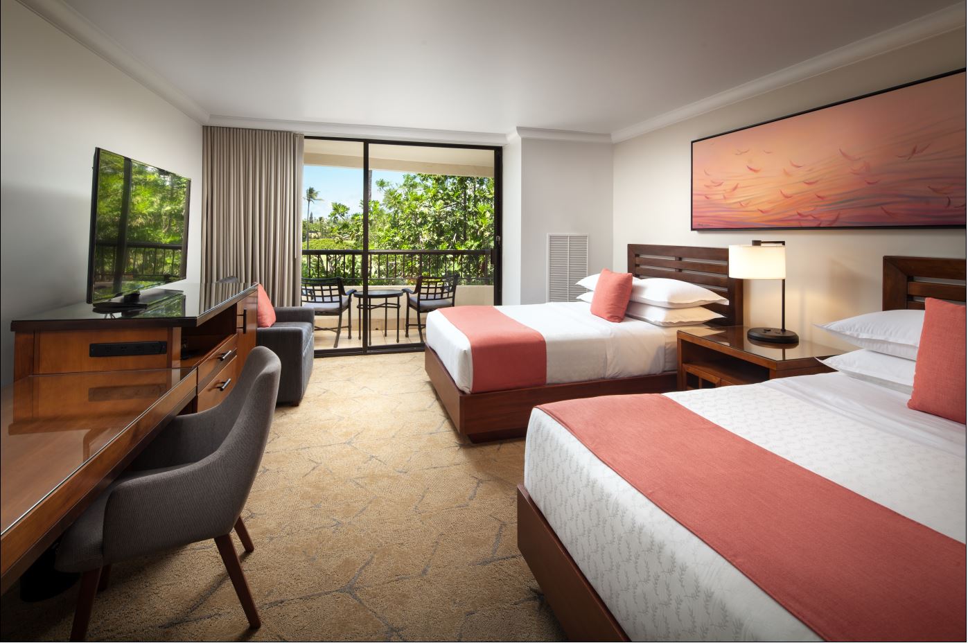 a room with two beds and a desk