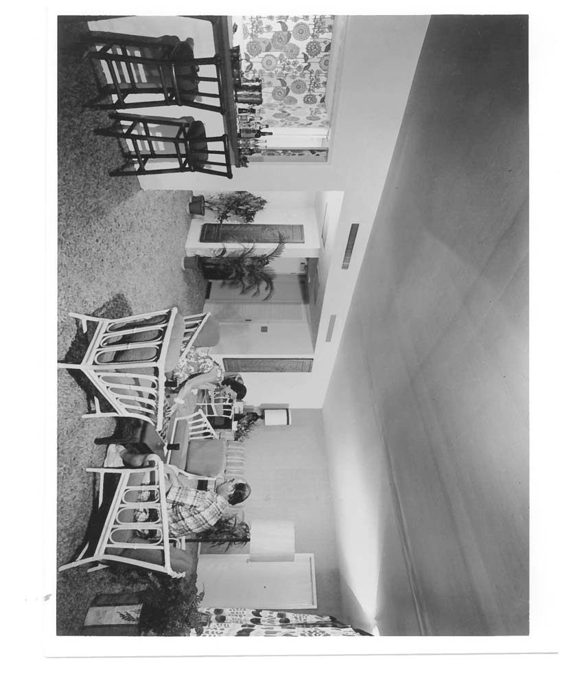 a couple of people sitting in a living room