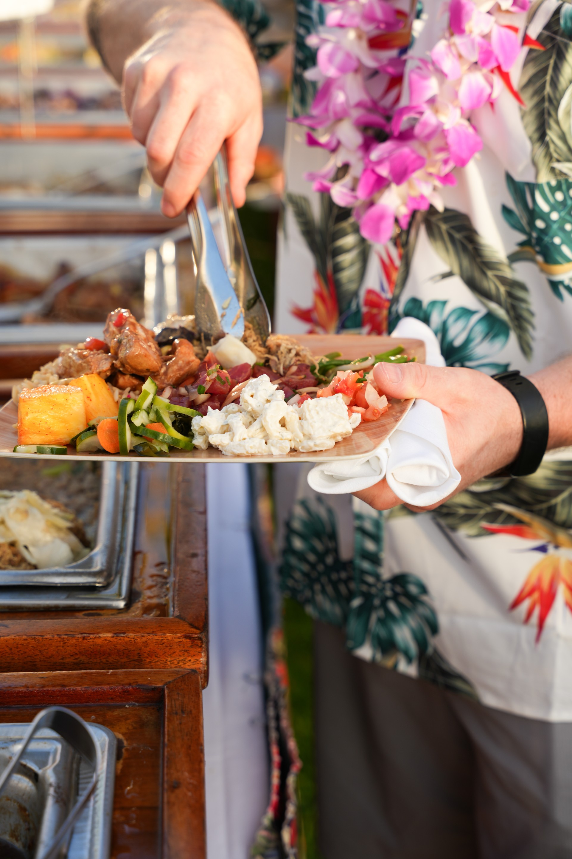 a person holding a plate of food