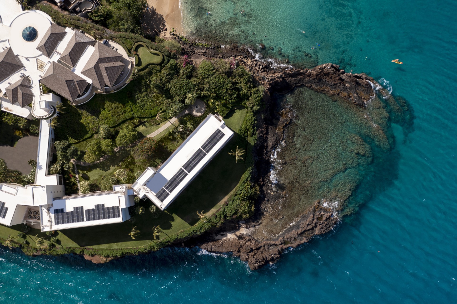 a house on an island with a body of water