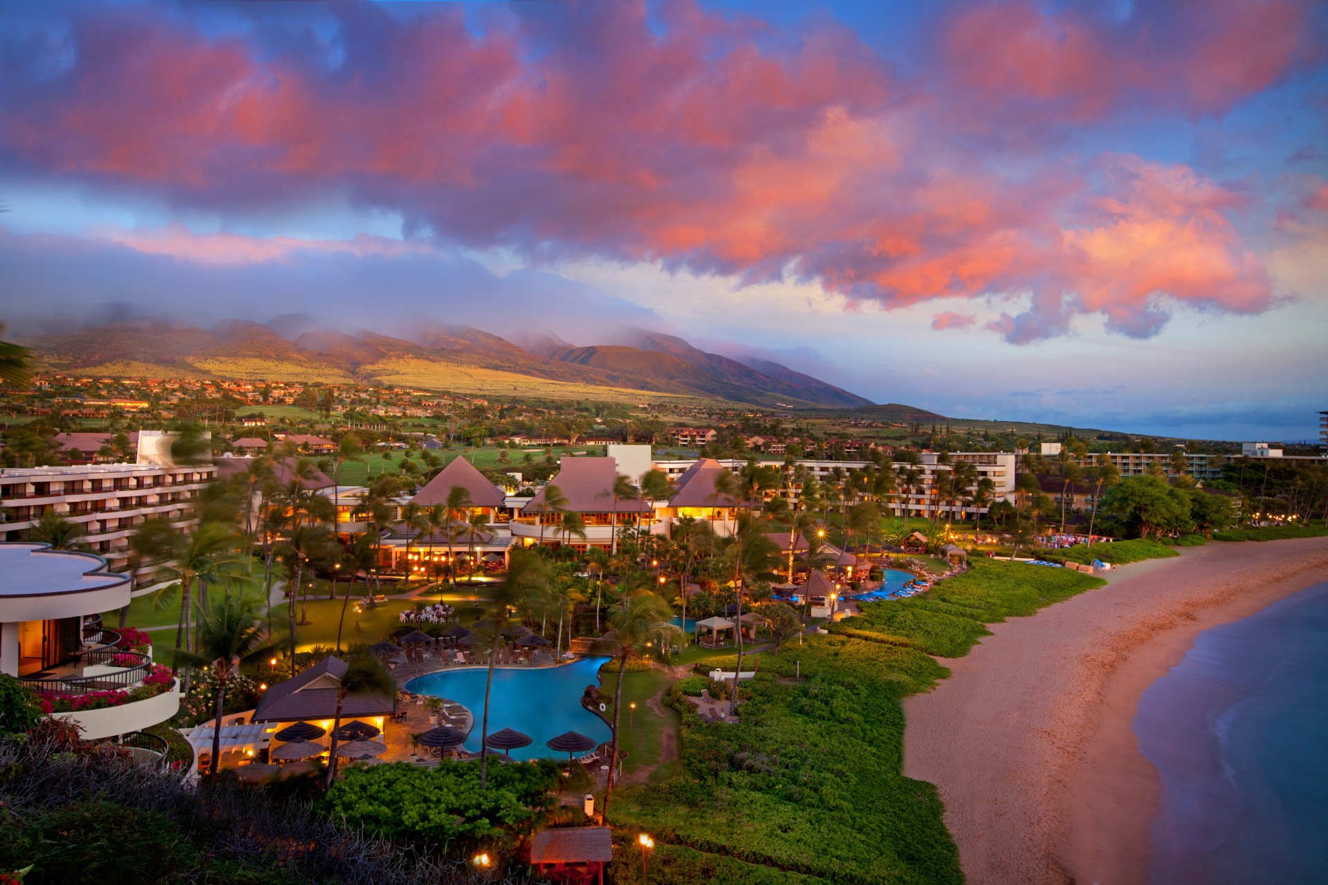 a resort with a pool and a beach