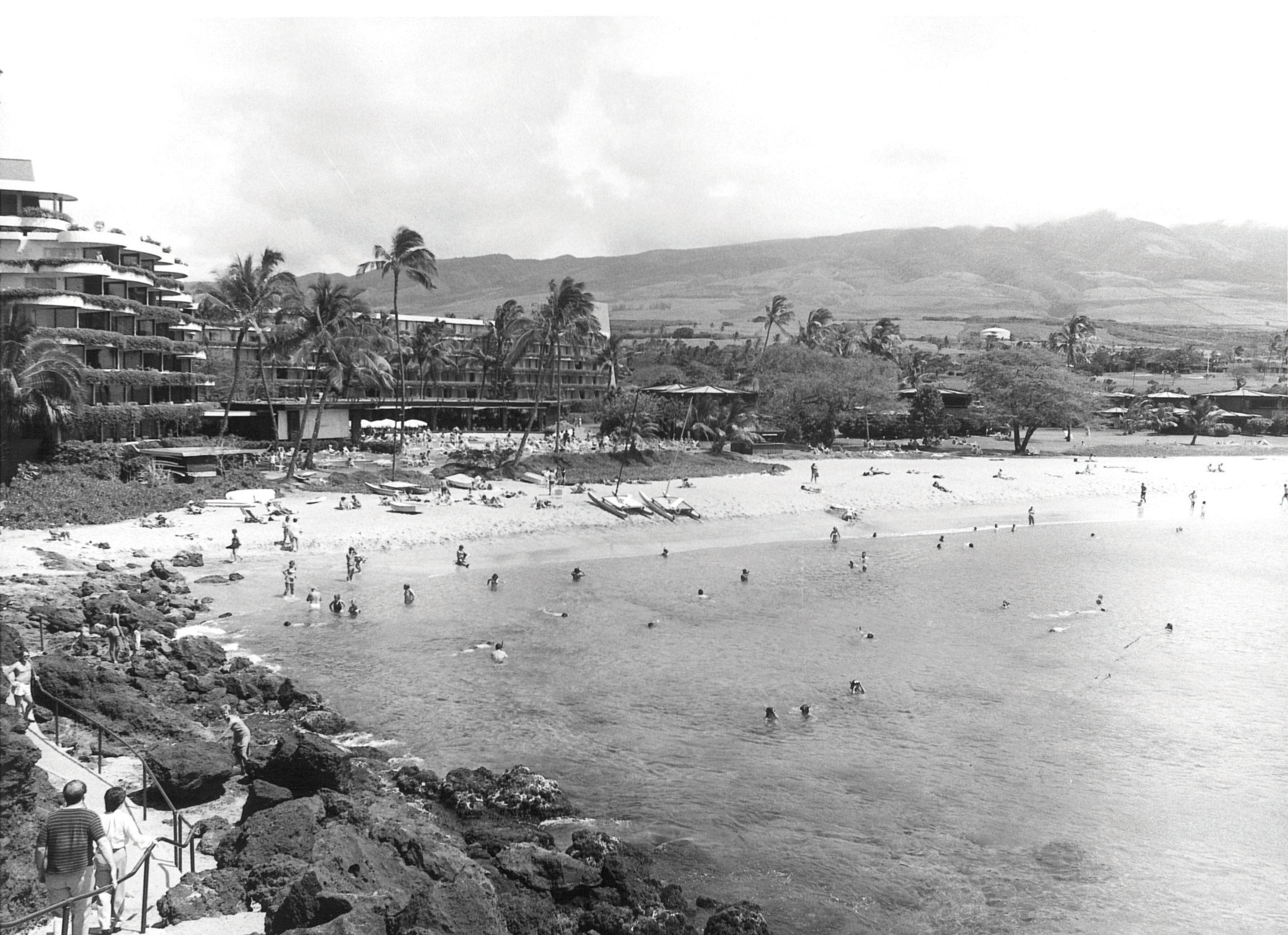 a black and white photo of a beach