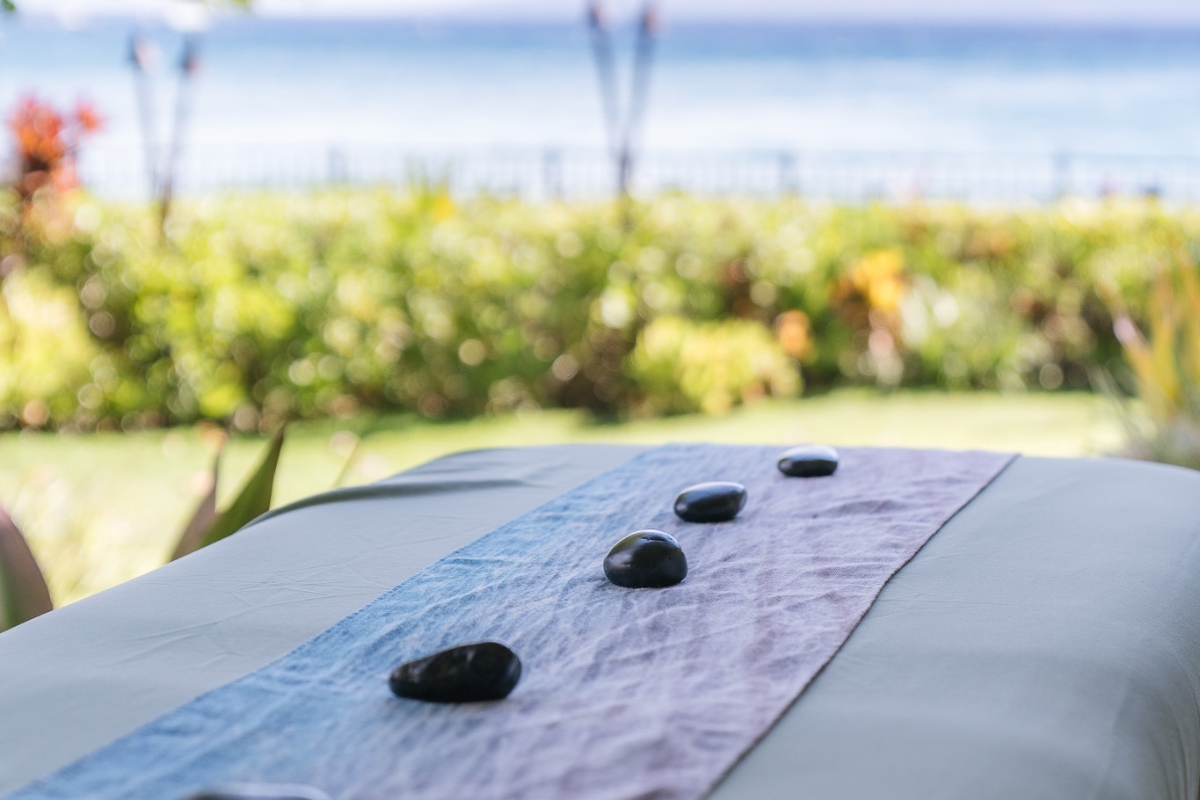 a group of black stones on a table