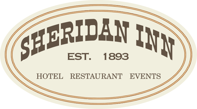 a white oval sign with brown text