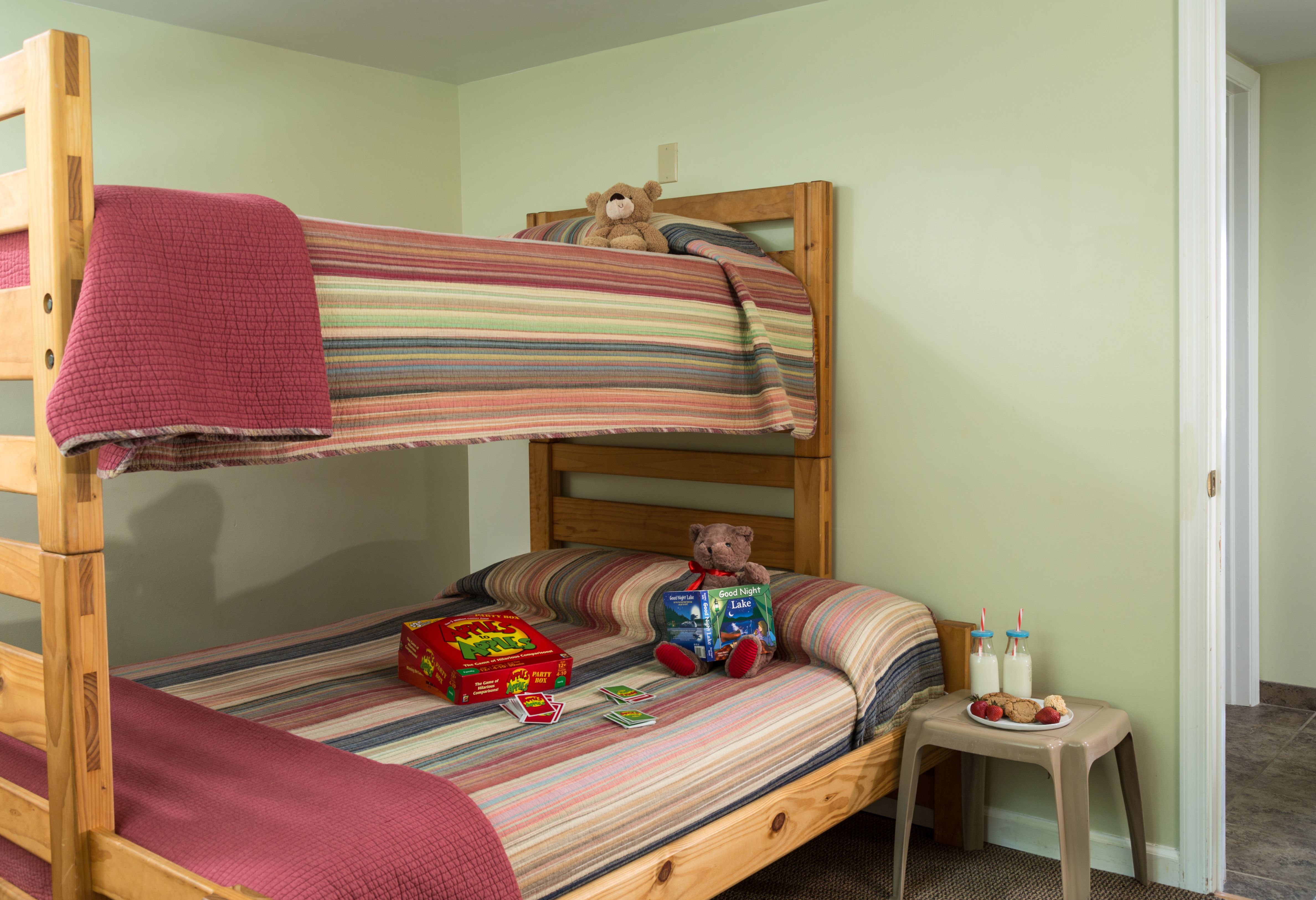 a bunk beds with a teddy bear on it