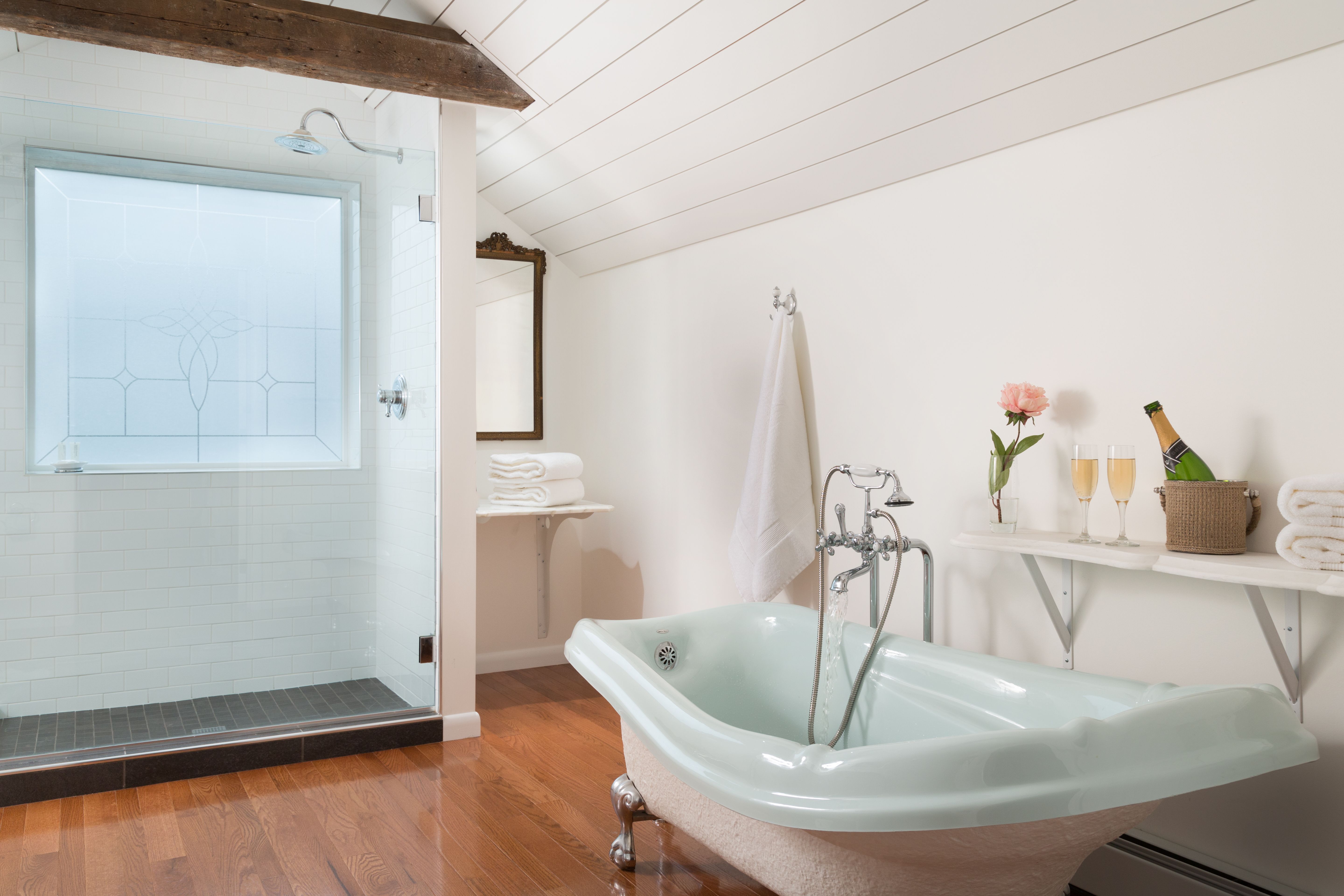 a bathroom with a bathtub and shower