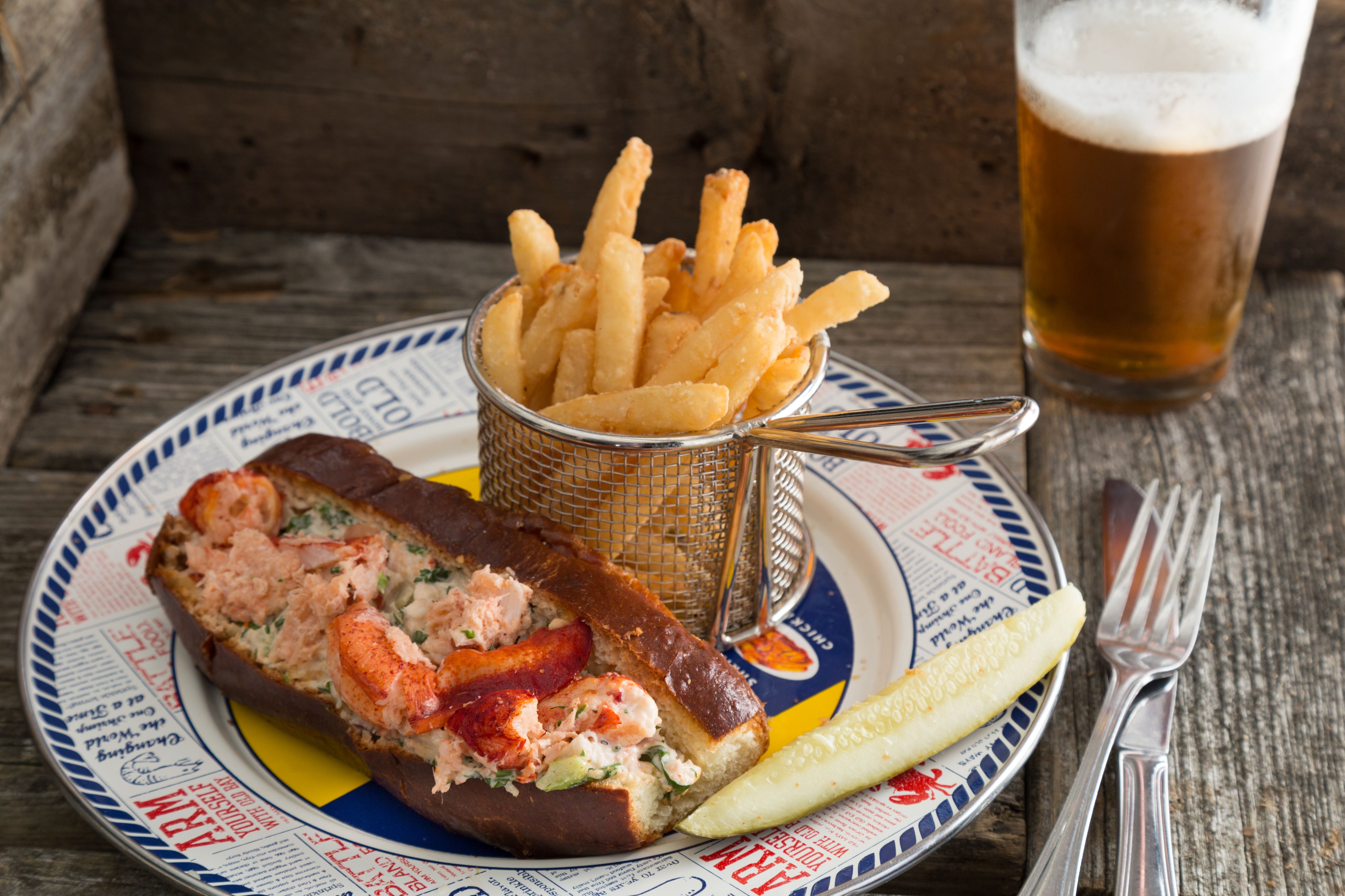 a plate of food with a glass of beer