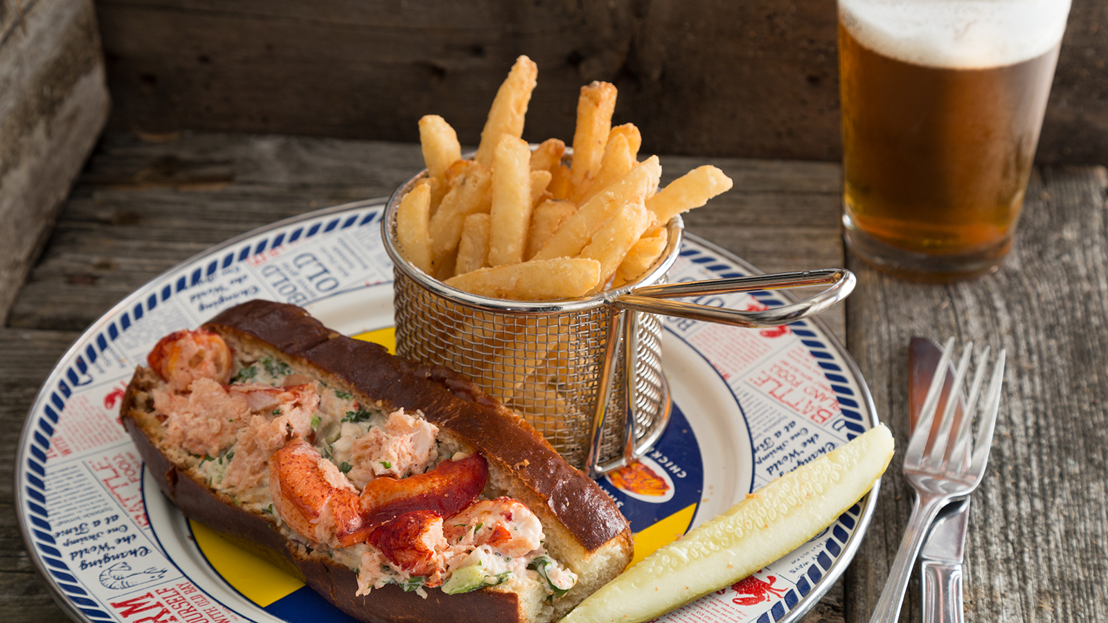 a plate of food with a glass of beer
