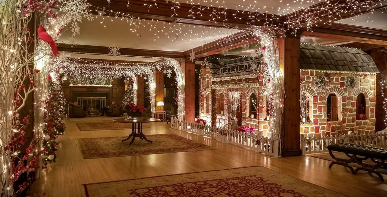 a room with a brick building and christmas lights