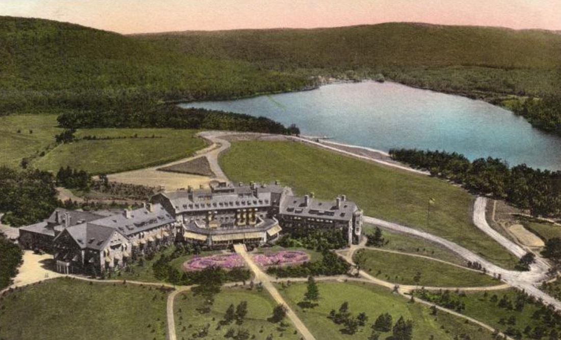 a large building surrounded by a lake