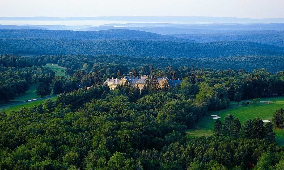 a large building surrounded by trees