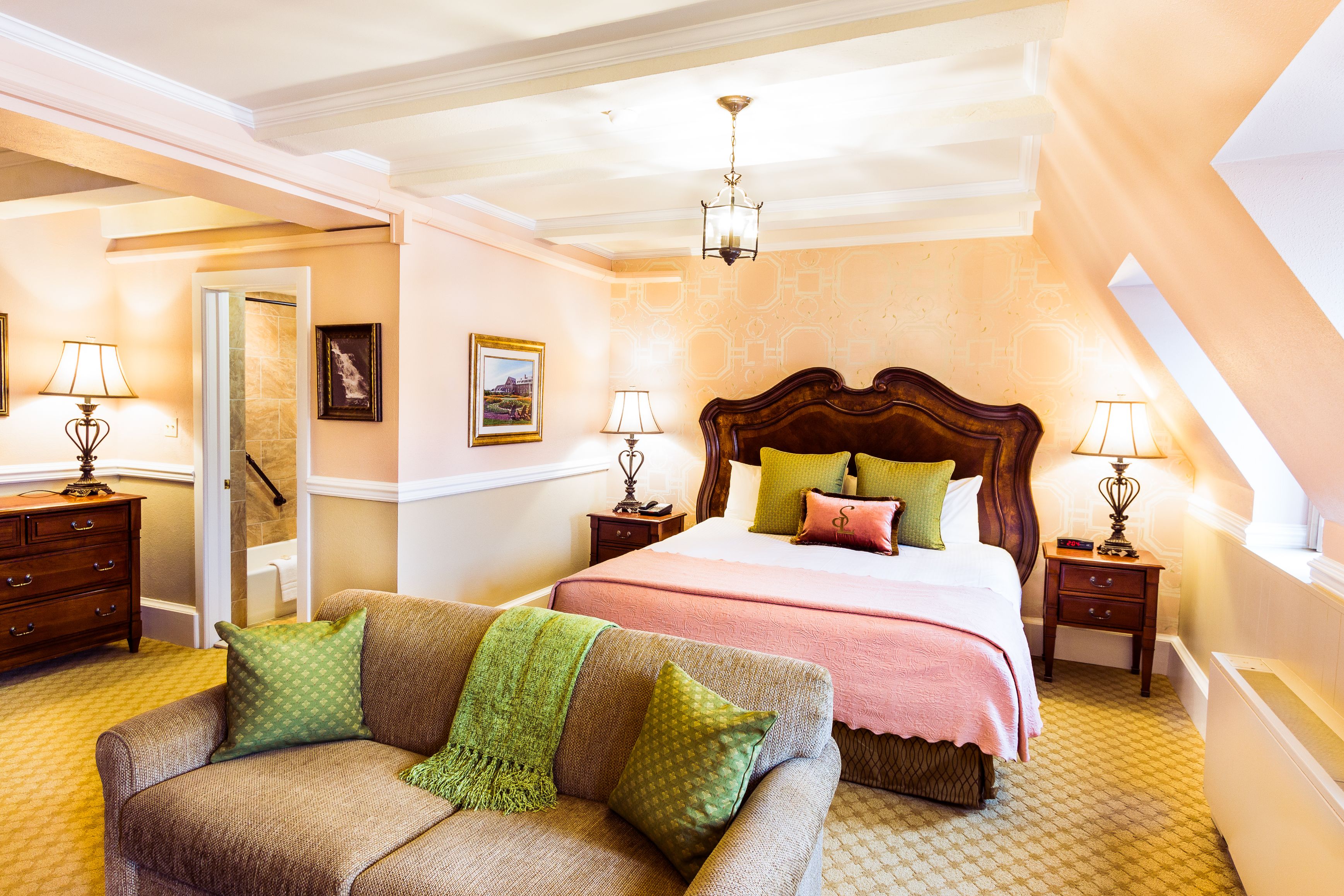 a bedroom with a bed and a couch