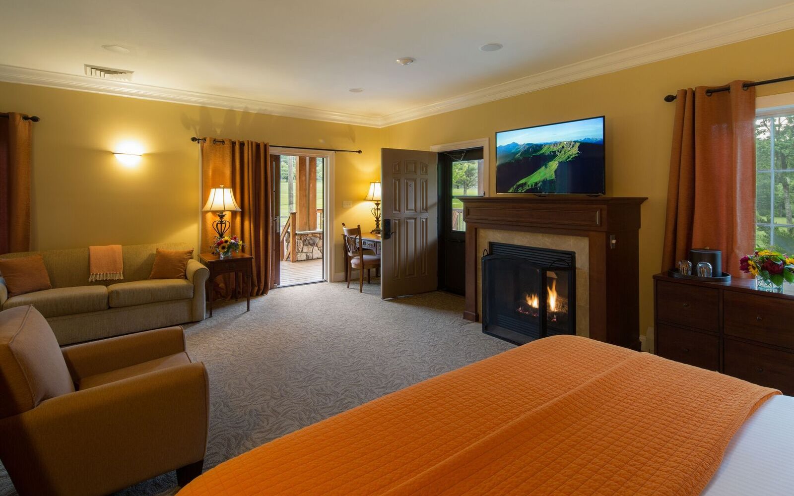 a room with a fireplace and a bed