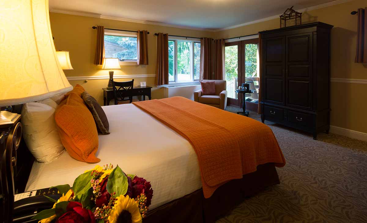 a room with a bed and a chair