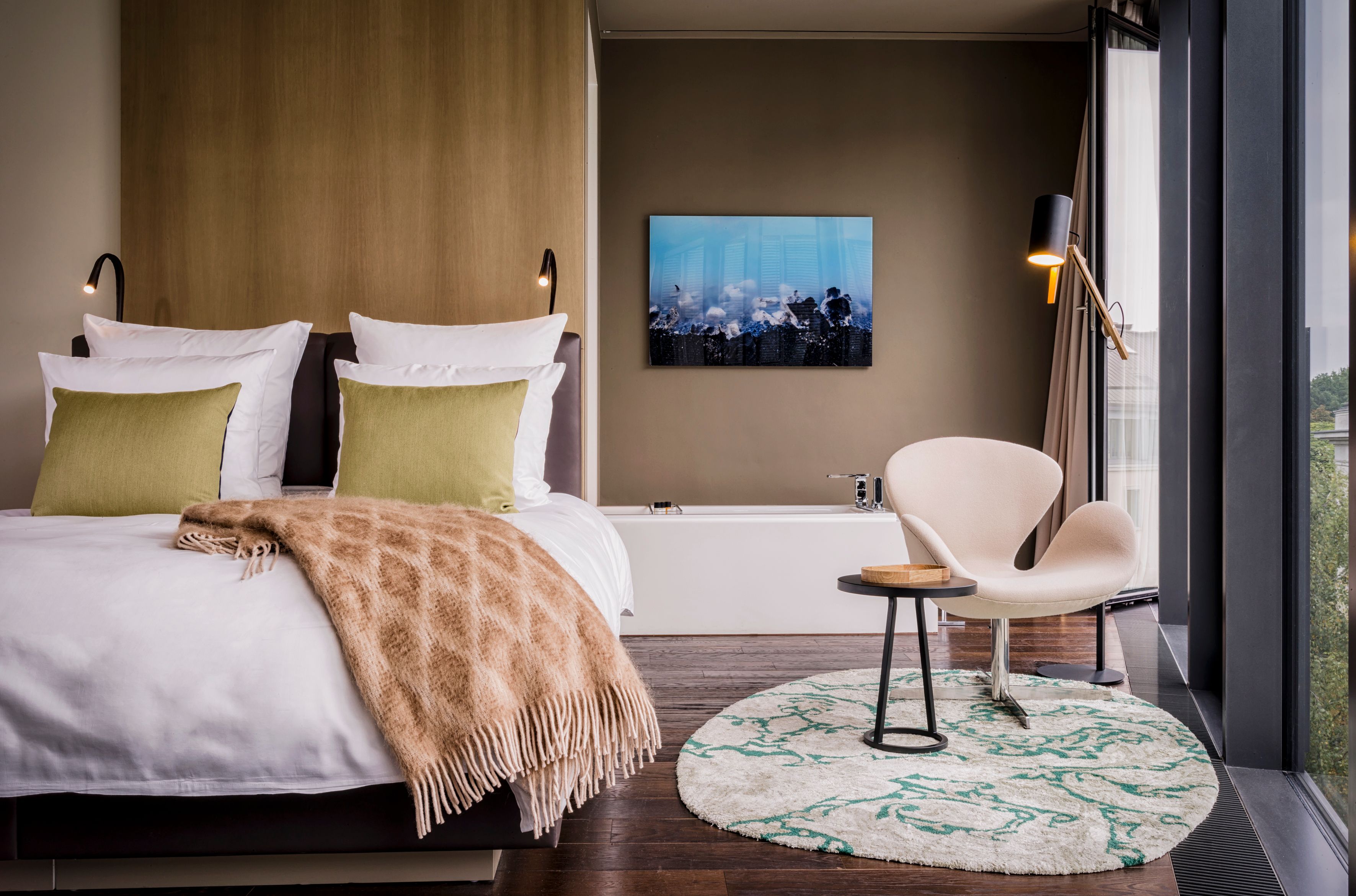 a bedroom with a bed and a bathtub