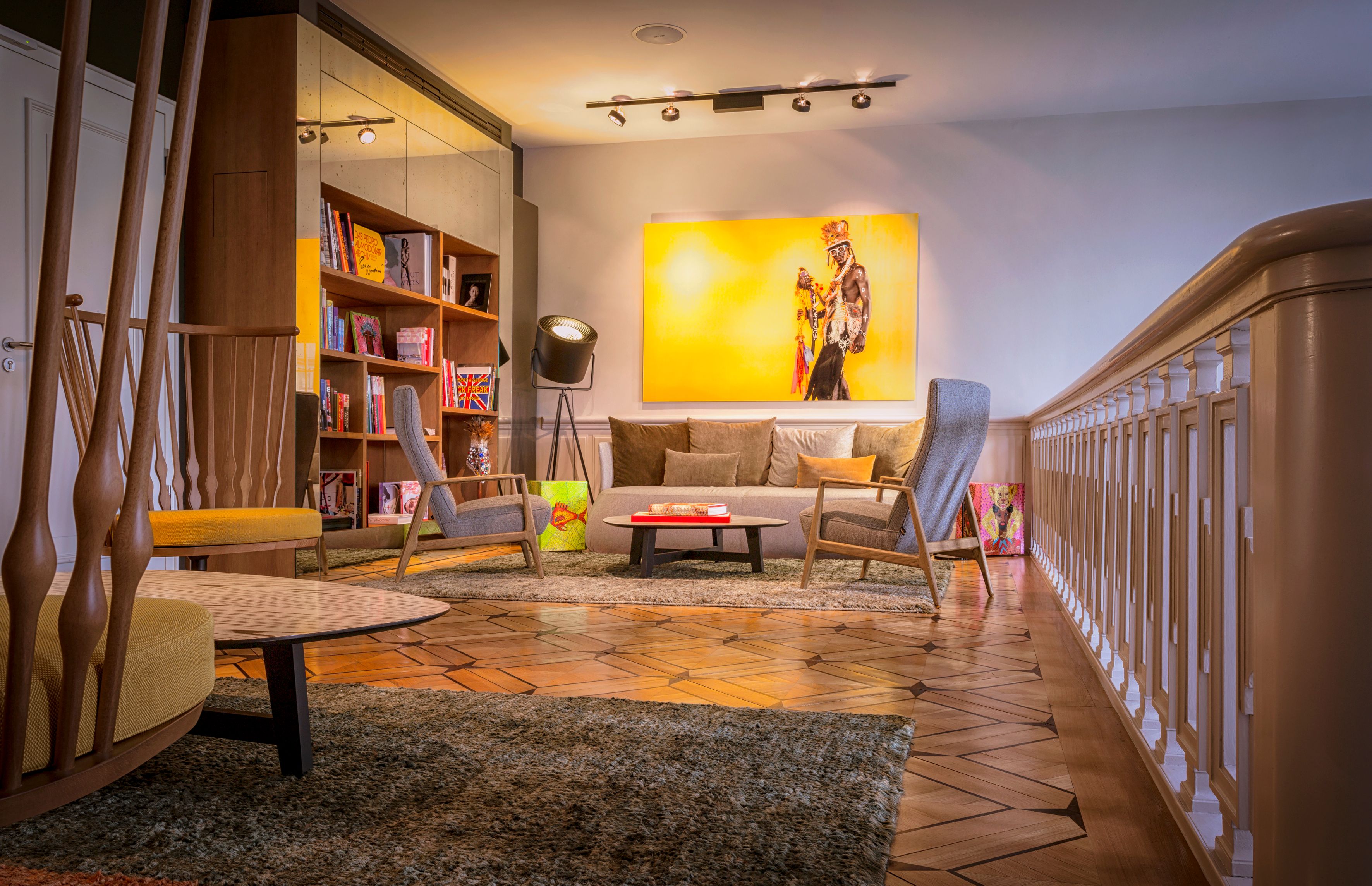 a room with a couch and a bookcase