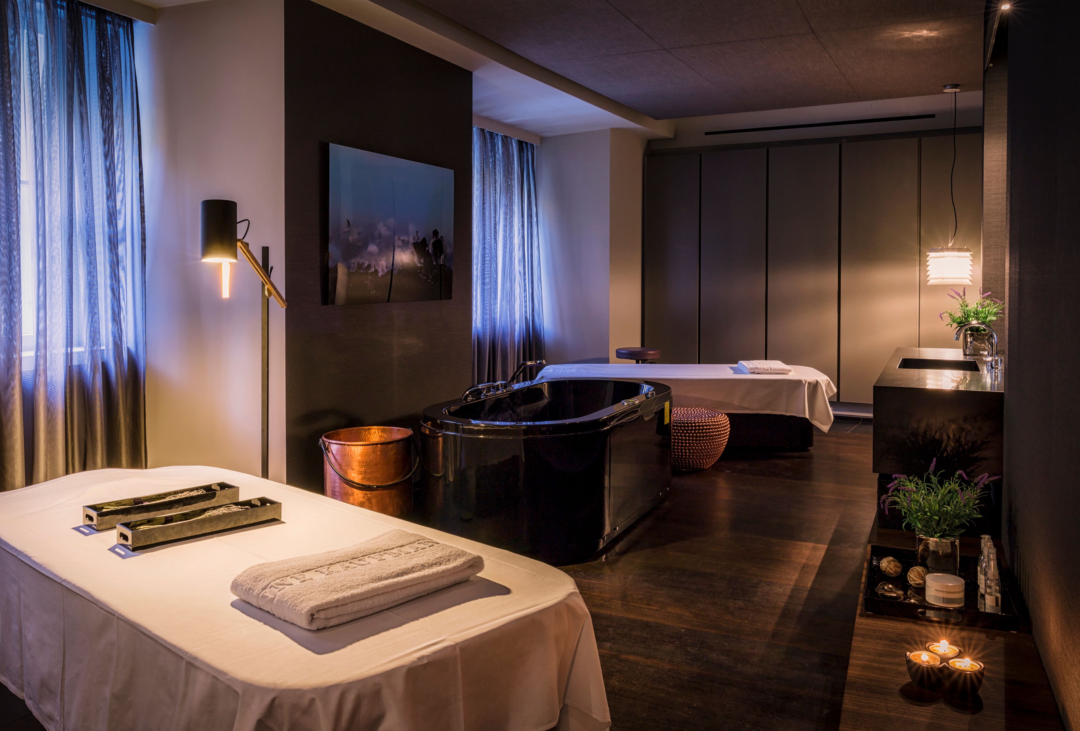 a room with a hot tub and a bathtub