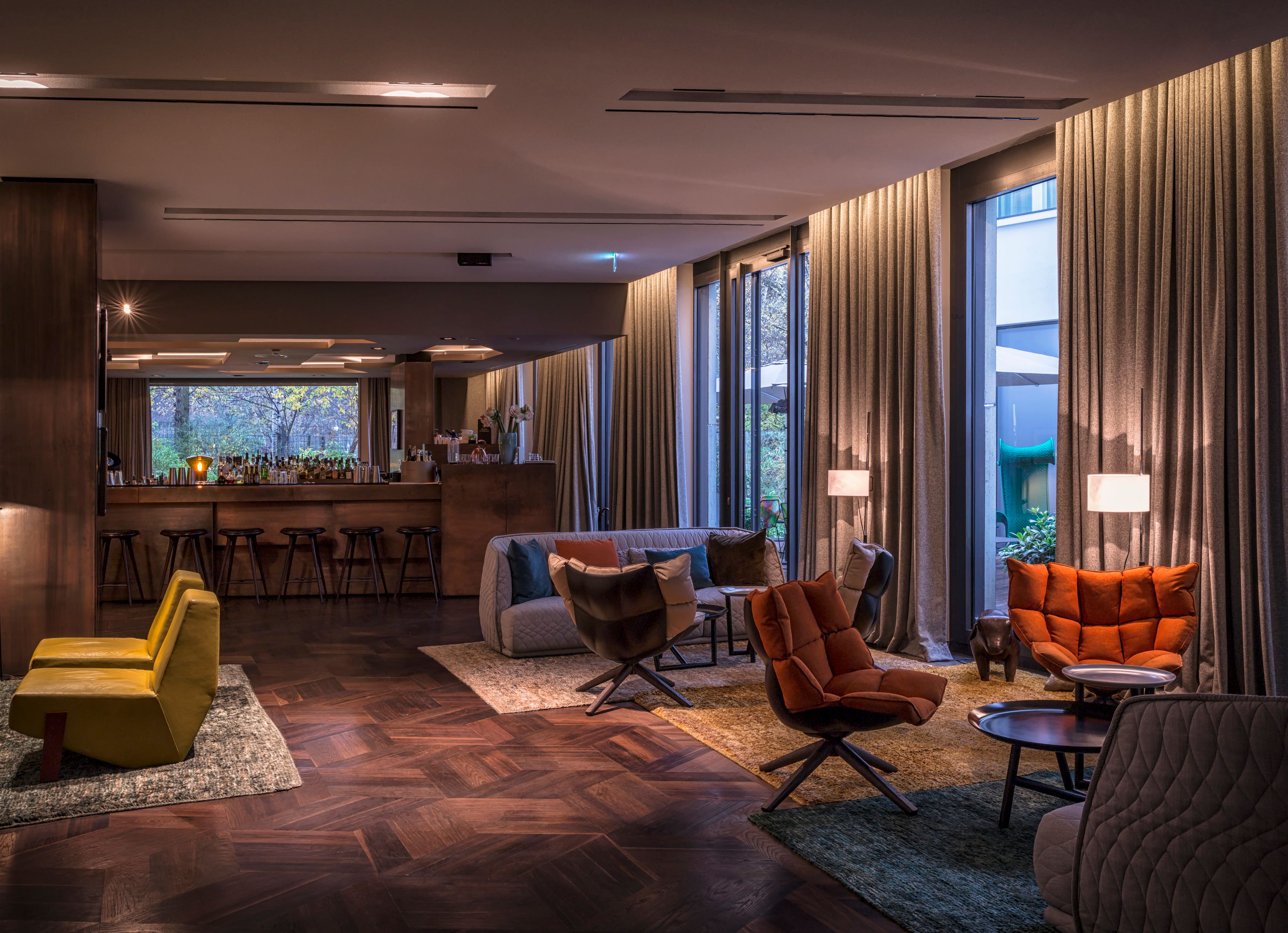 a room with a bar and chairs