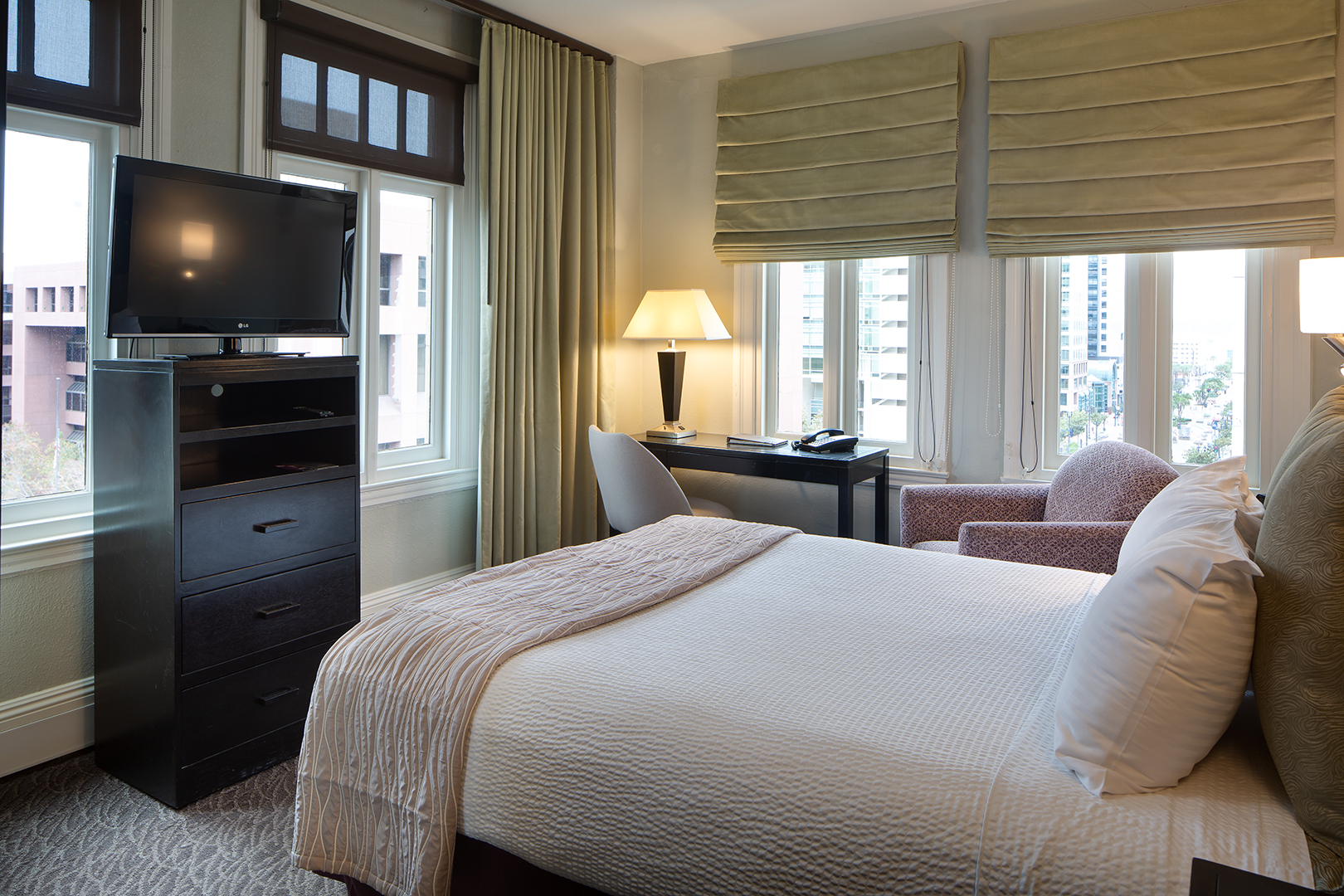 image of guestroom with queen bed and television sofia hotel san diego california_high