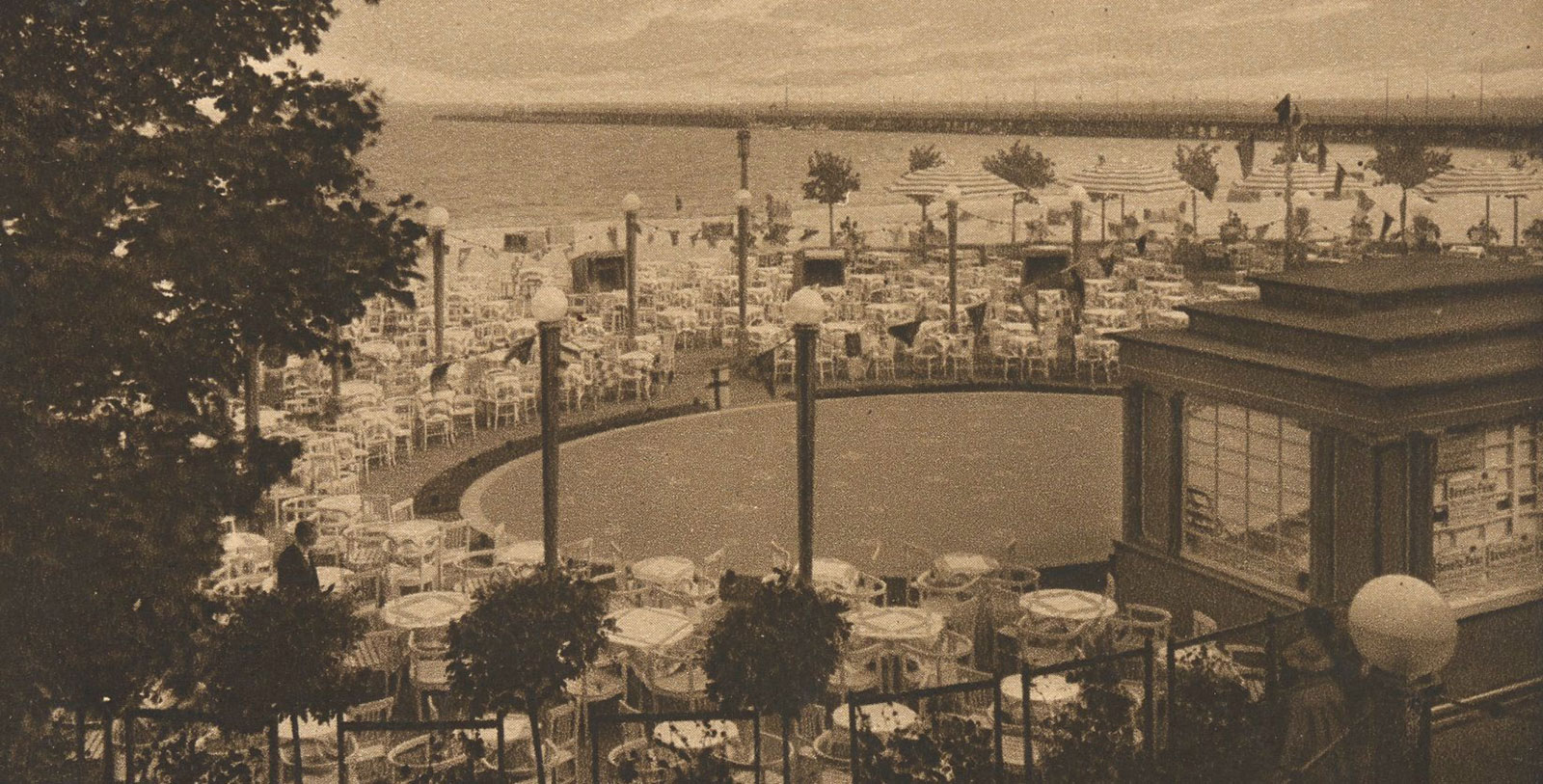a large outdoor restaurant area with tables and chairs