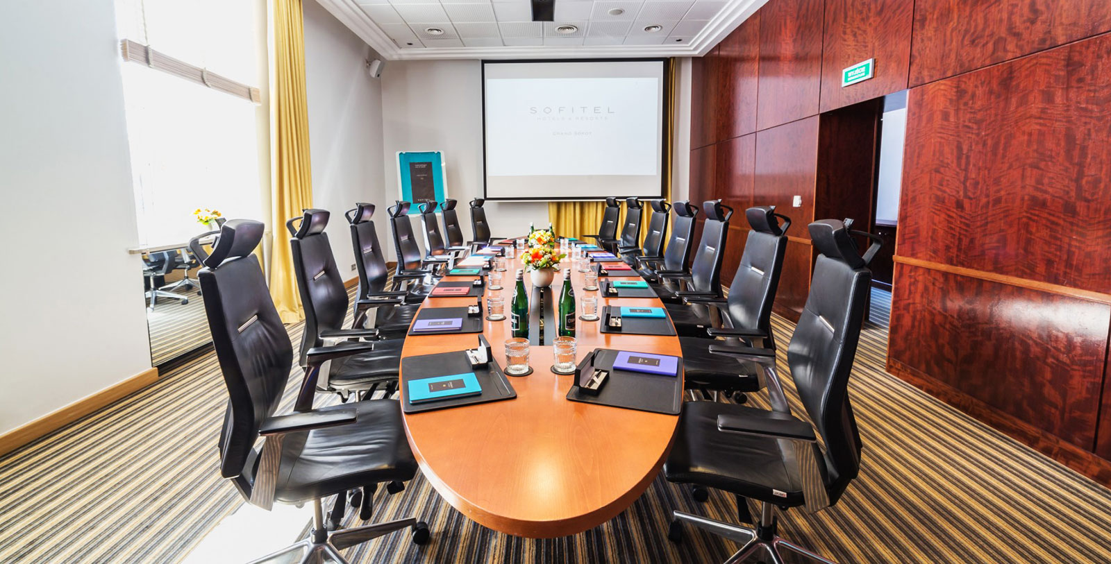 a conference room with a large table and chairs