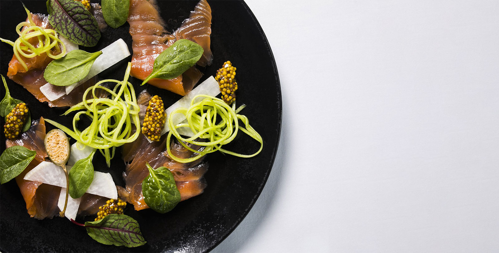 a plate of food on a white surface
