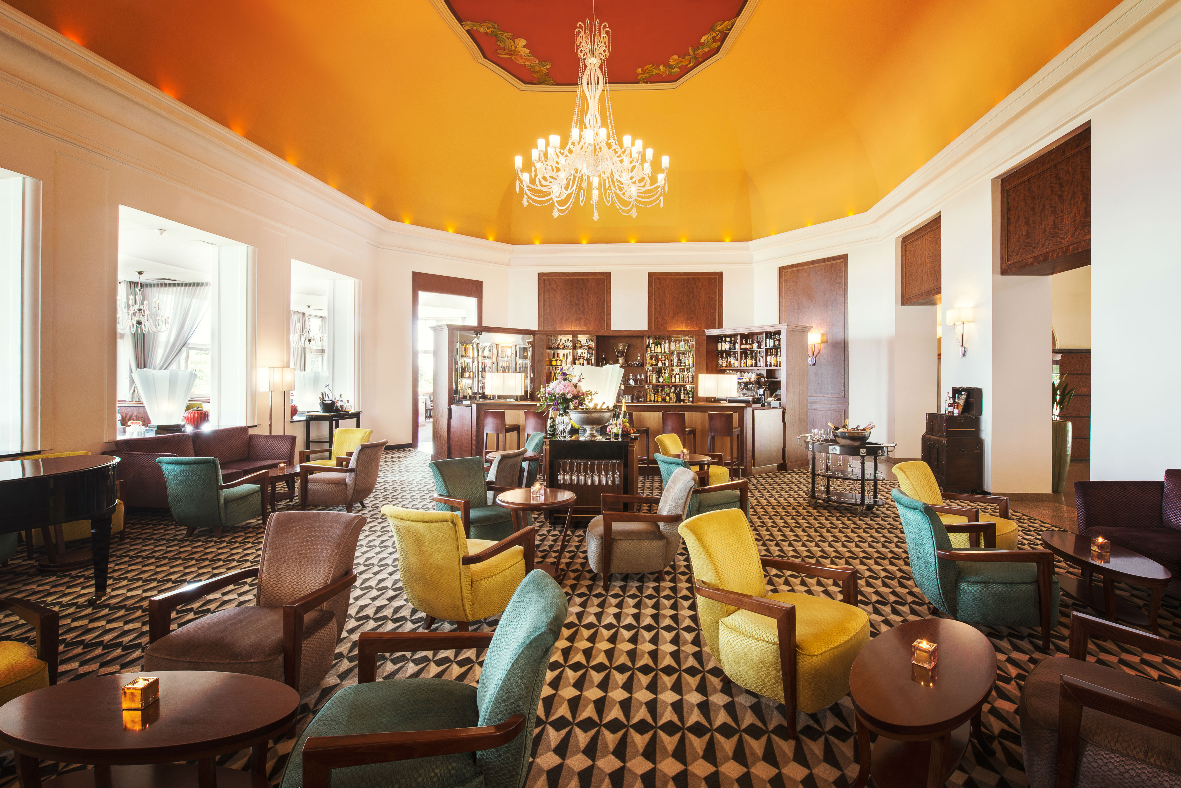 a room with chairs and a chandelier