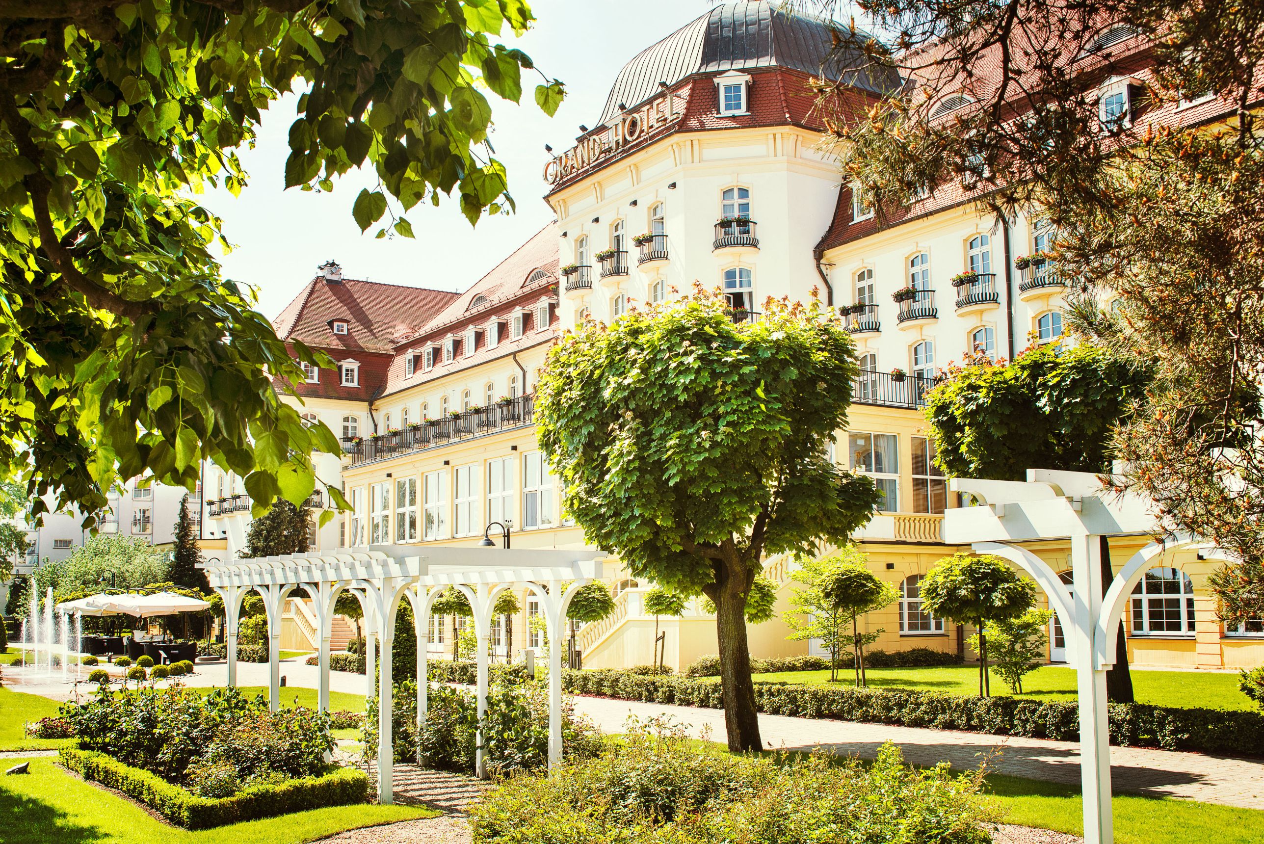 a building with trees and a walkway