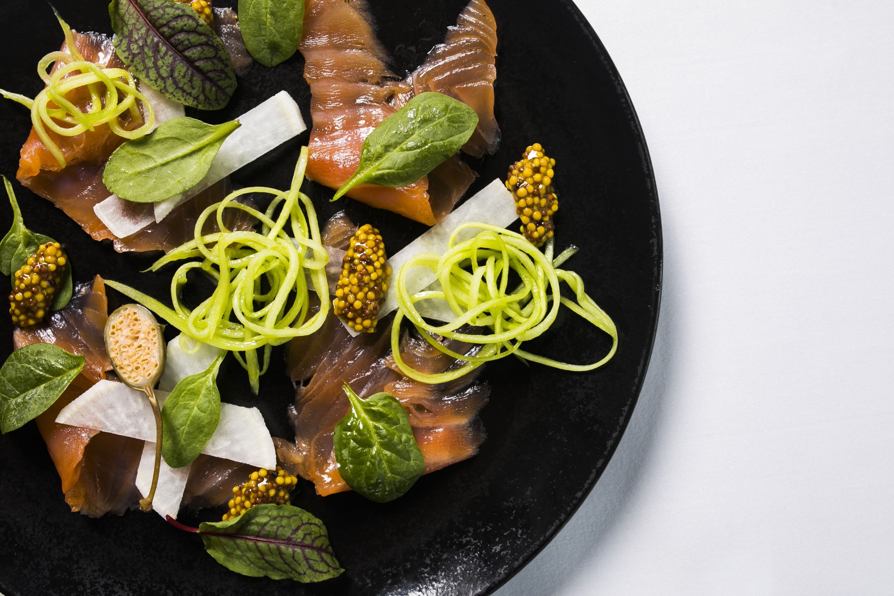 a plate of food on a white surface