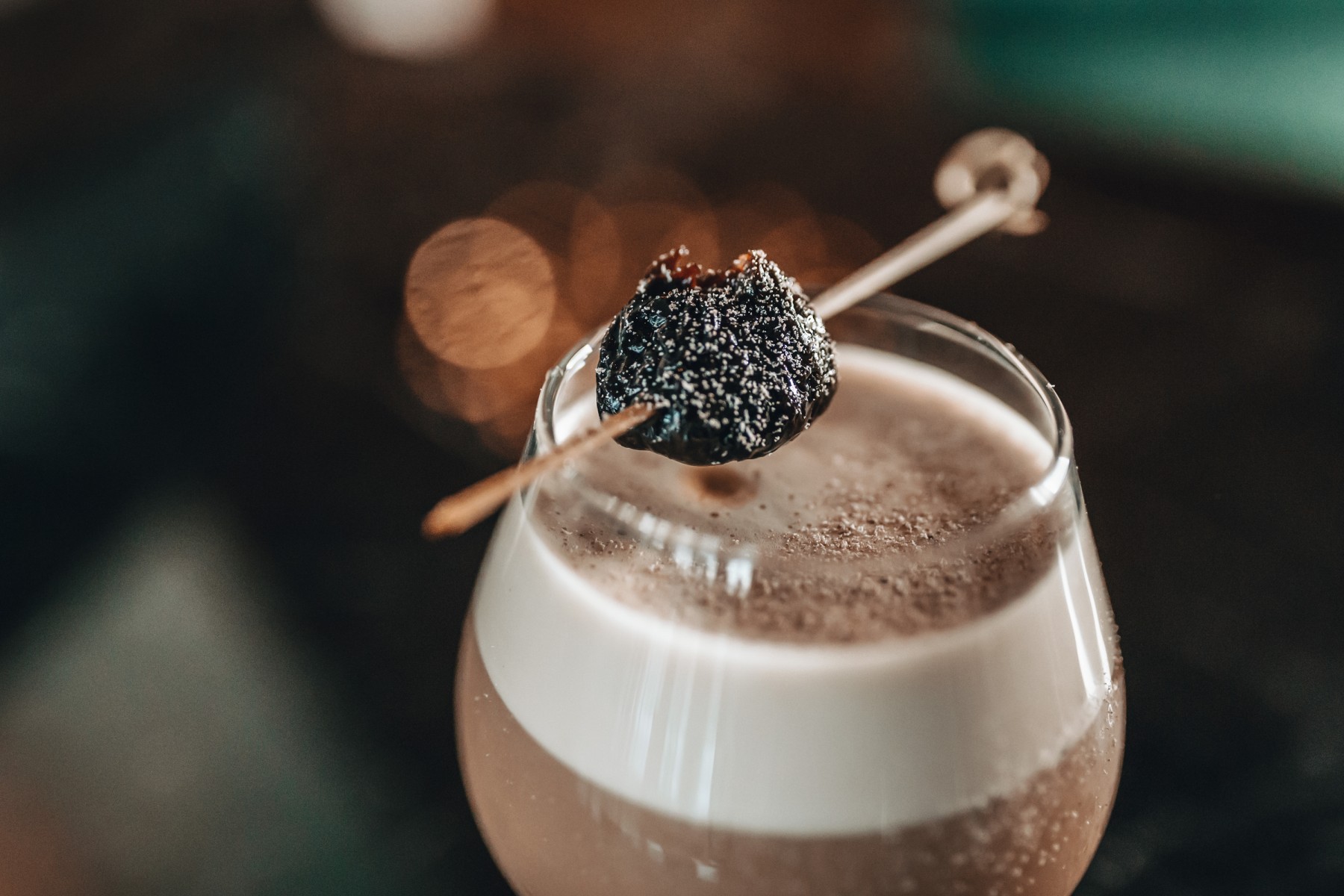 a drink with a skewer on top