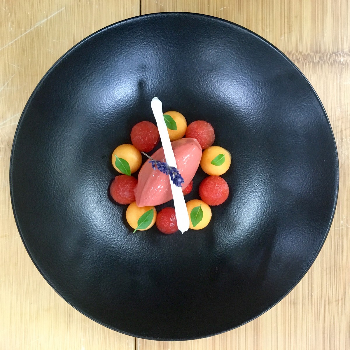 a black bowl with food on it