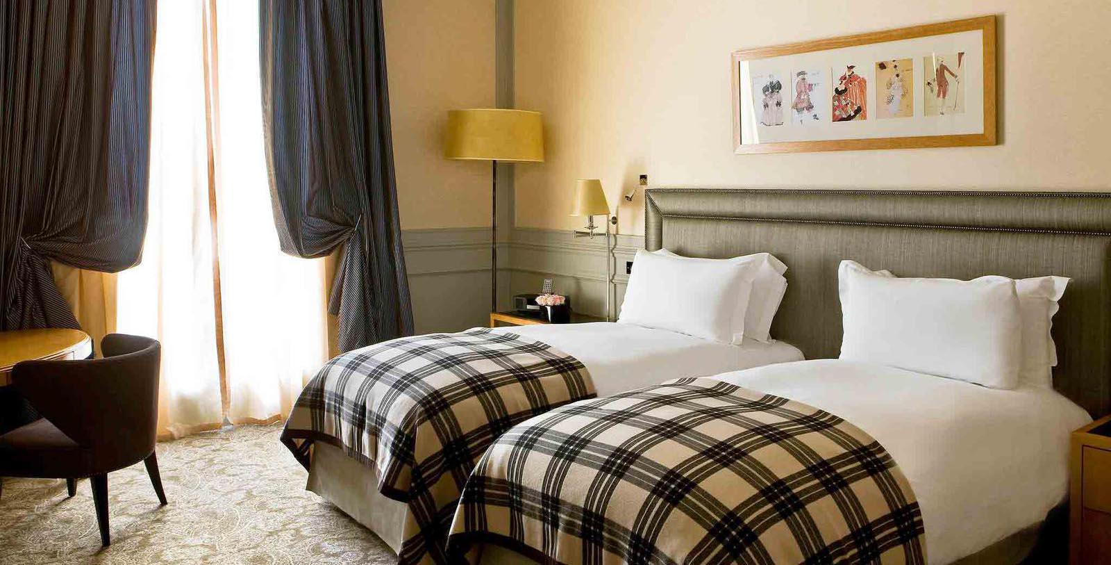 a couple beds in a hotel room