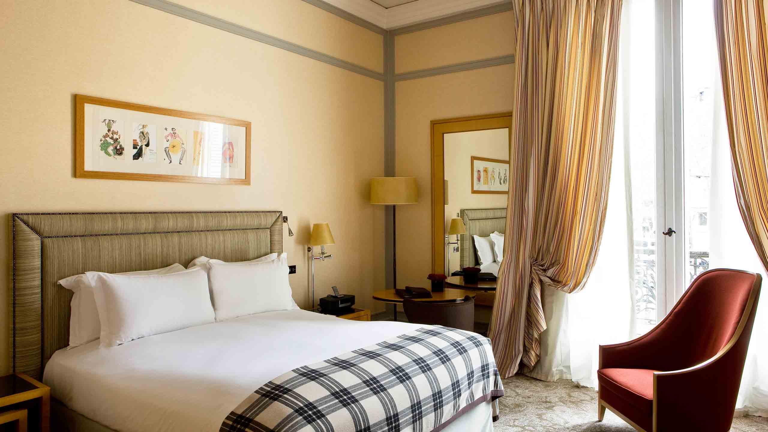 a room with a bed and a mirror