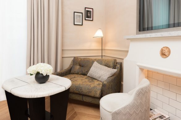 a living room with a fireplace and a couch