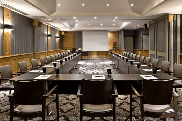 a room with a large table and chairs